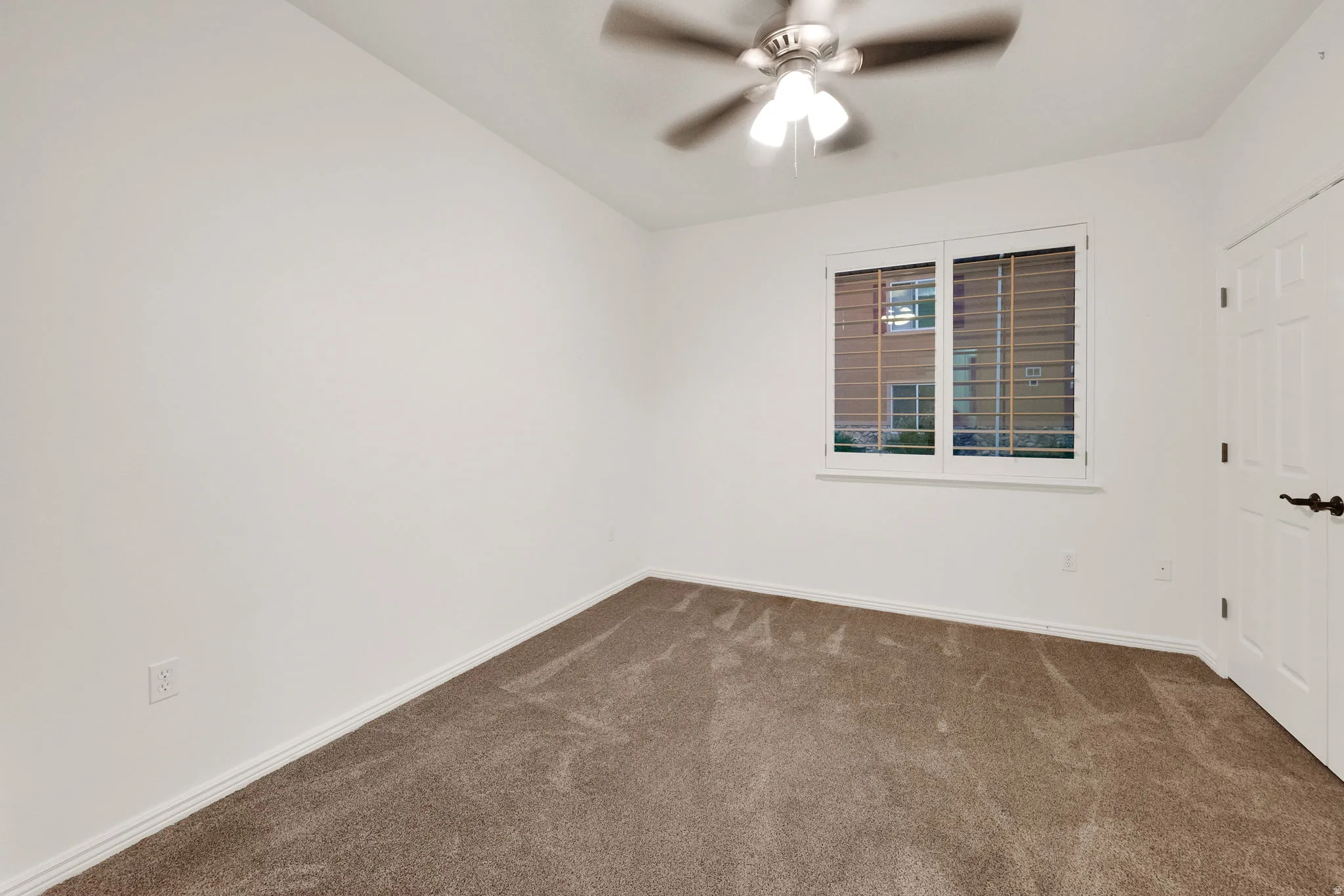 Neutral-toned carpeting complements bright white walls