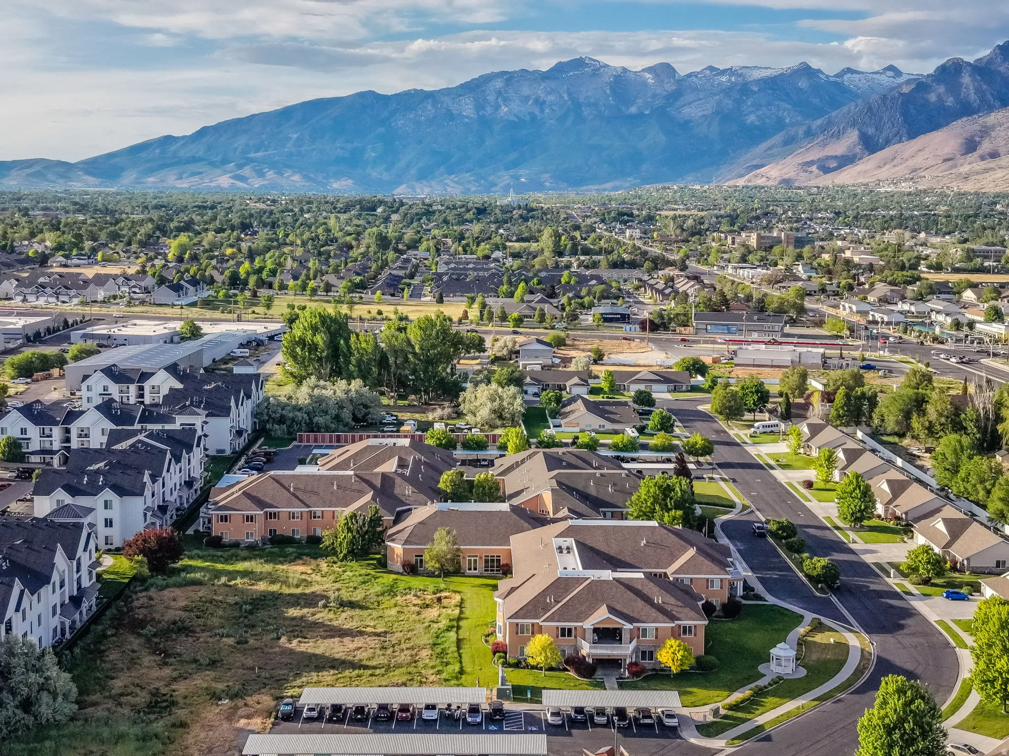 Expansive aerial perspective showcasing a developed residential area with distant mountain ranges