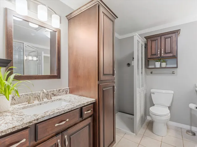 Bathroom vanity with a granite countertop and an undermount sink