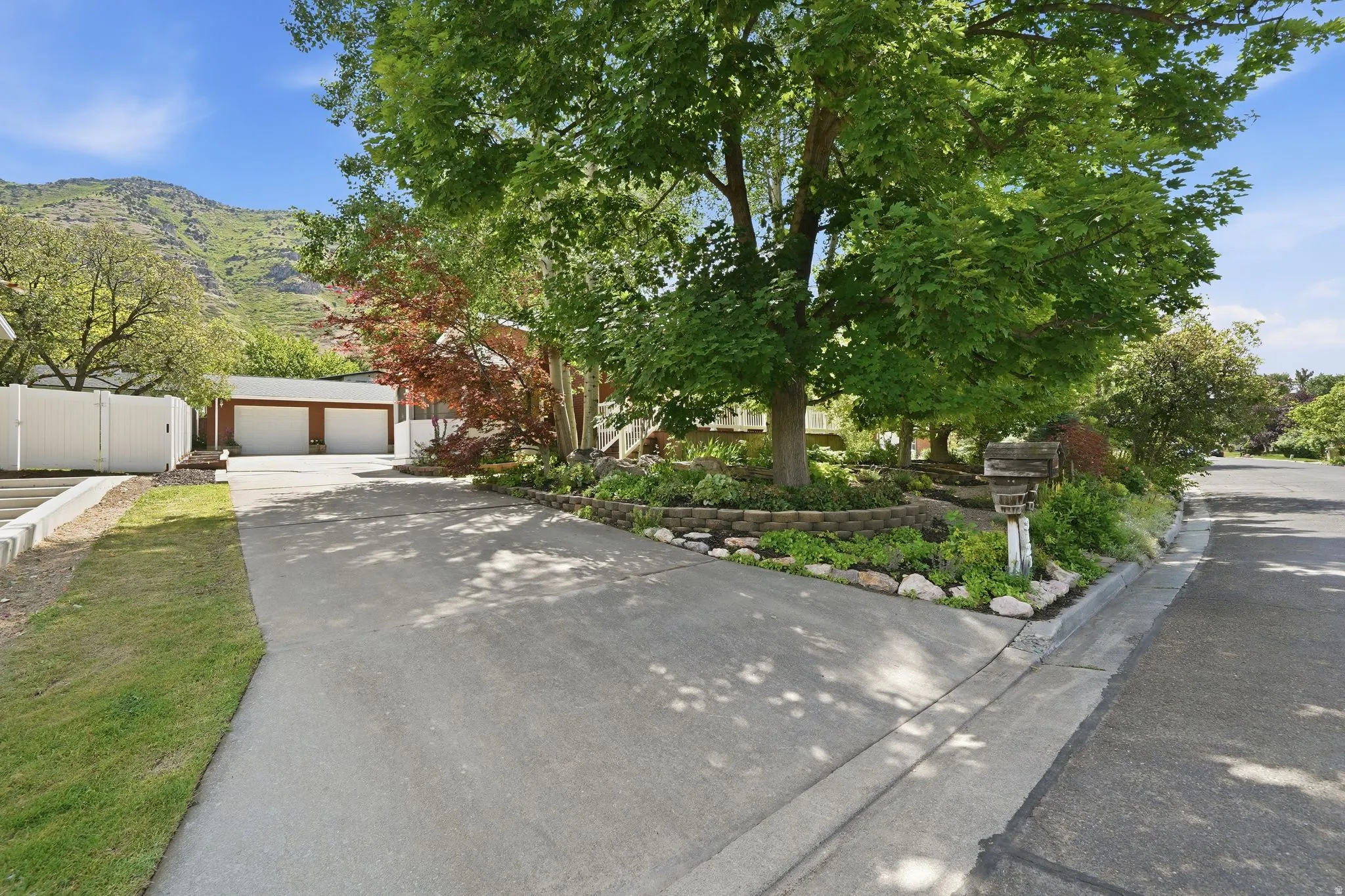 Paved driveway offering access to the property's two-car garage