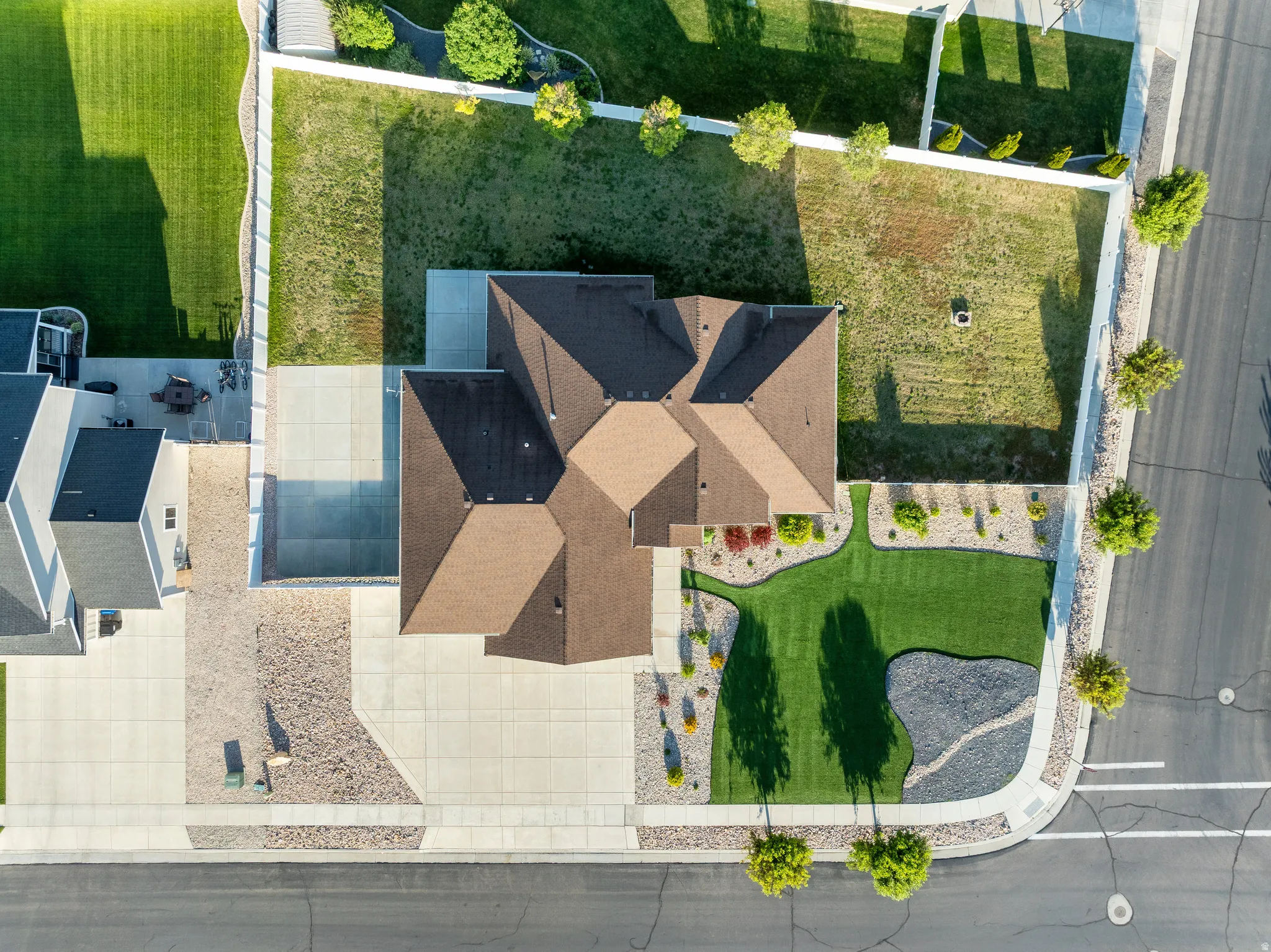 Single-story residence featuring a brown shingle roof, concrete driveway, and an attached two-car garage