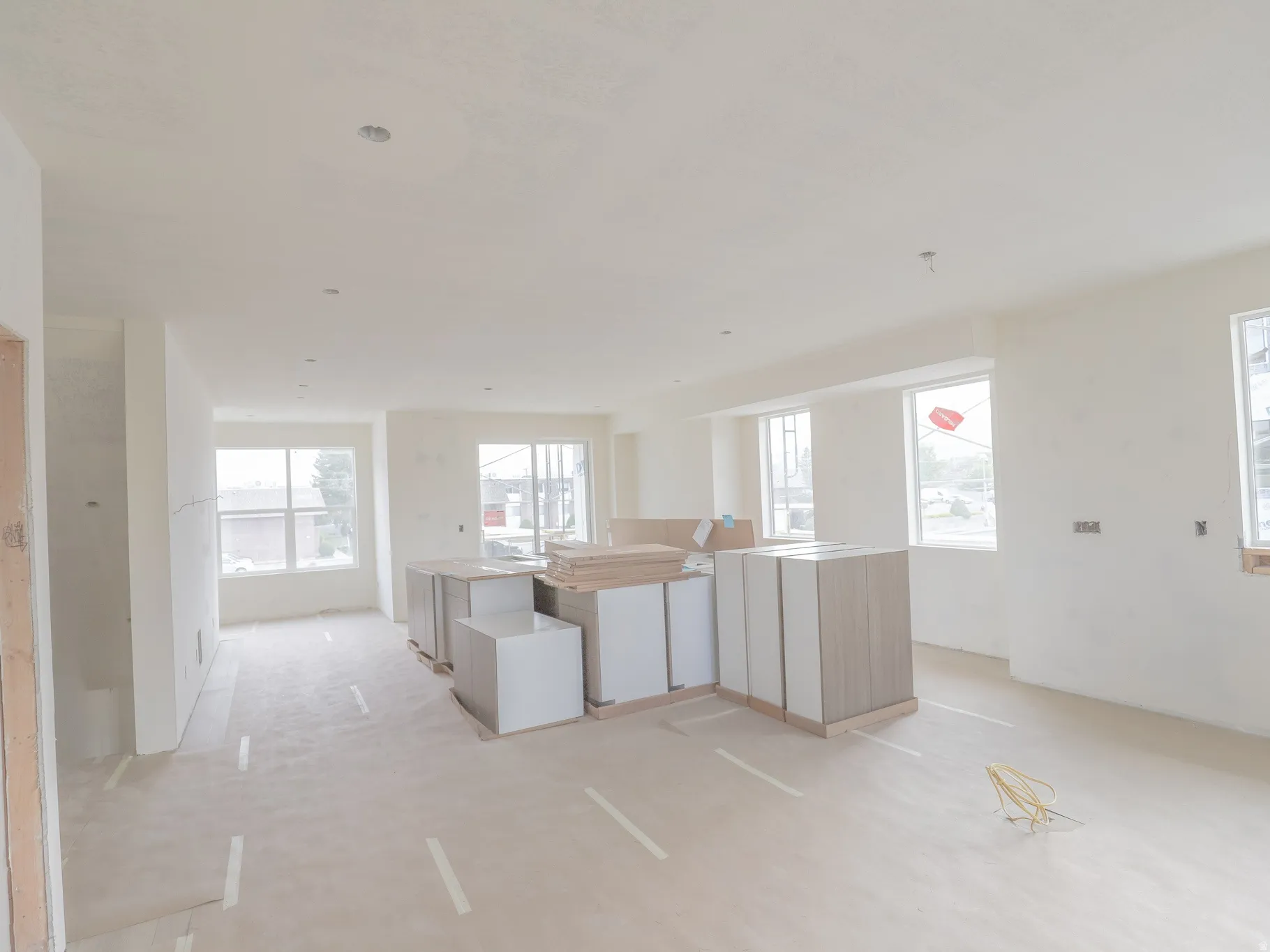 Expansive interior space featuring multiple windows