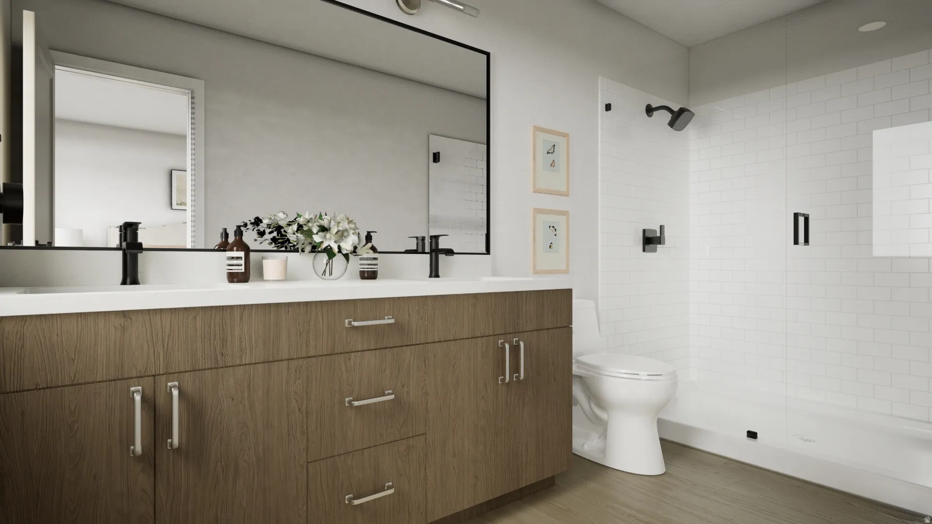Dual vanity with wood-finish cabinetry and matte black faucets, complemented by a large framed mirror