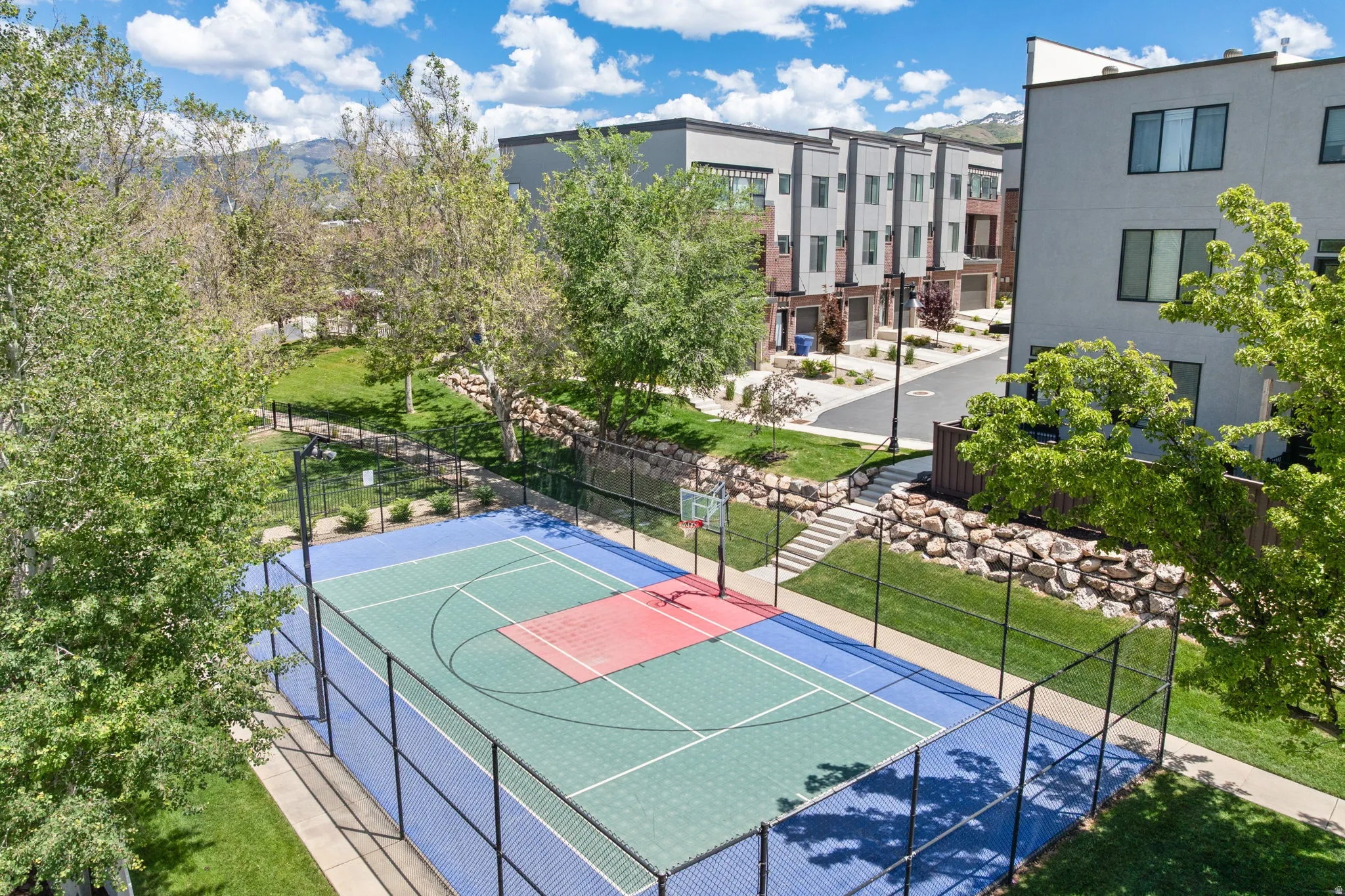 Multi-sport court with vibrant blue and green surfacing