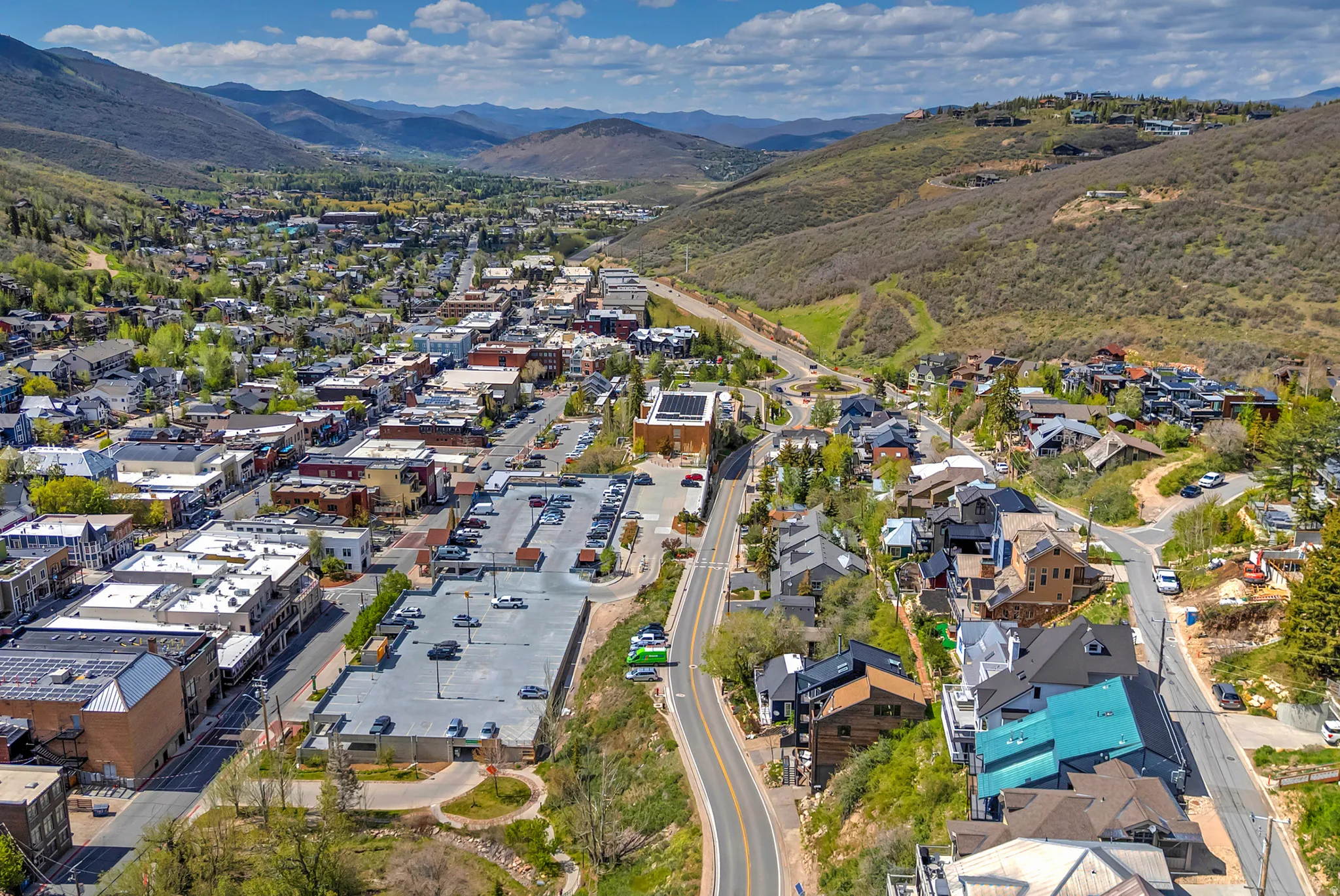 Aerial perspective of a mountain town featuring commercial and residential structures