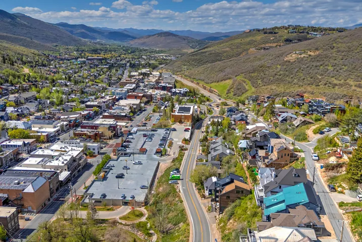 Aerial perspective of a mountain town featuring commercial and residential structures