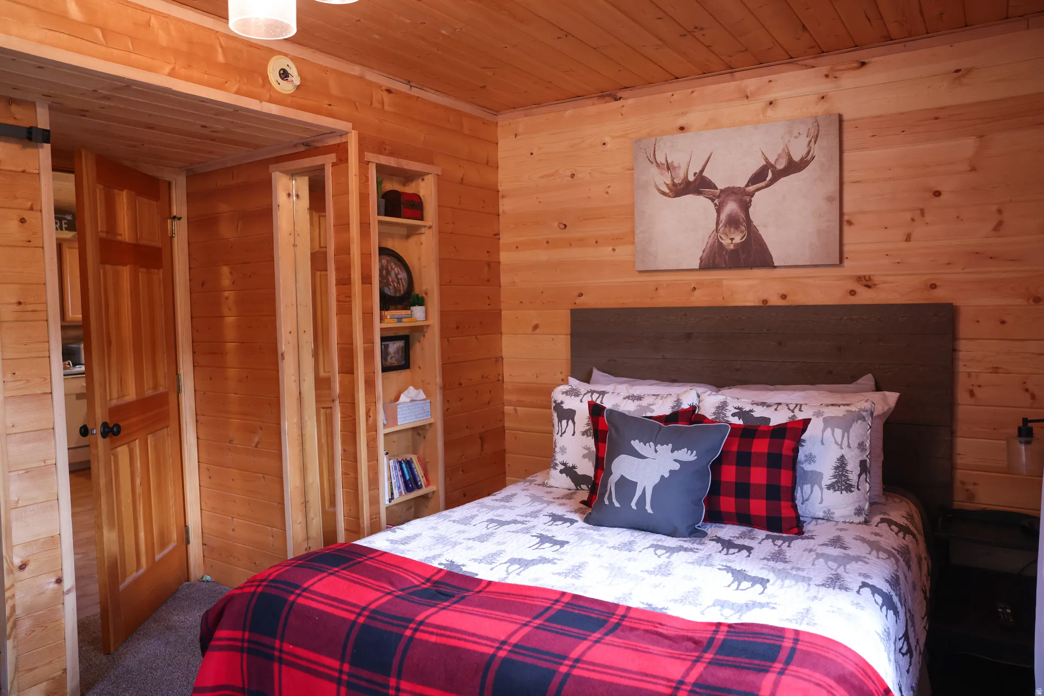 Paneled interior featuring natural wood walls and ceiling