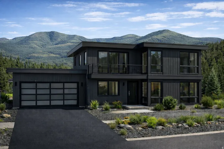 Modern black exterior featuring a flat roofline and extensive windows