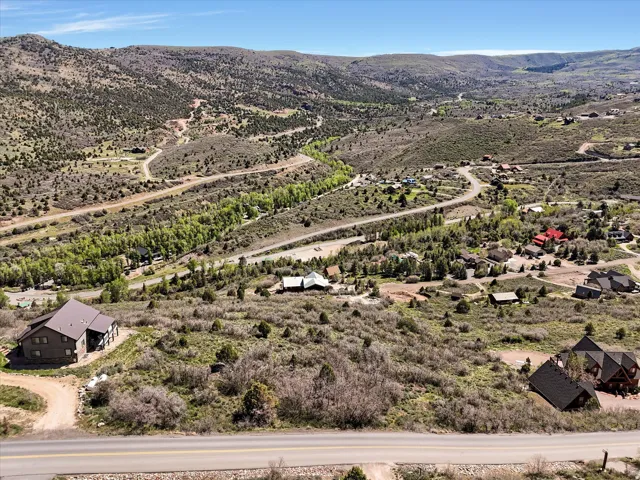 Fall views. Expansive hillside property featuring natural vegetation and distant residential structures