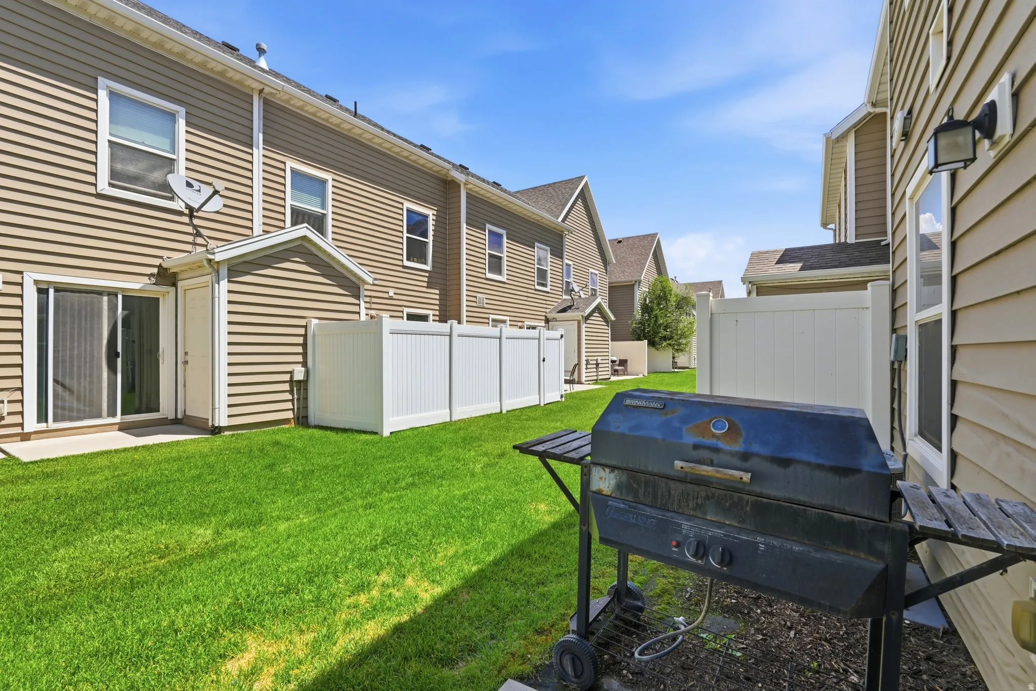 Lawn area with outdoor patio