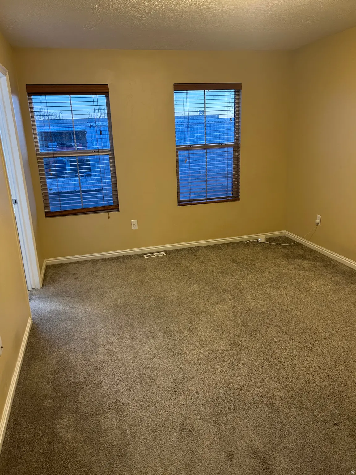 Master bedroom with carpet flooring