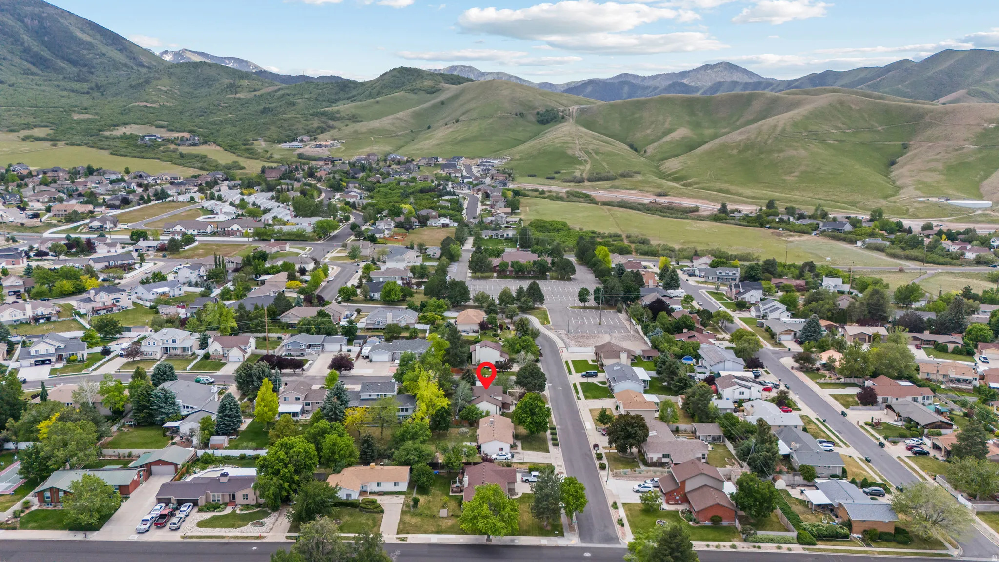 Suburban neighborhood setting featuring a residential street grid and varied home styles