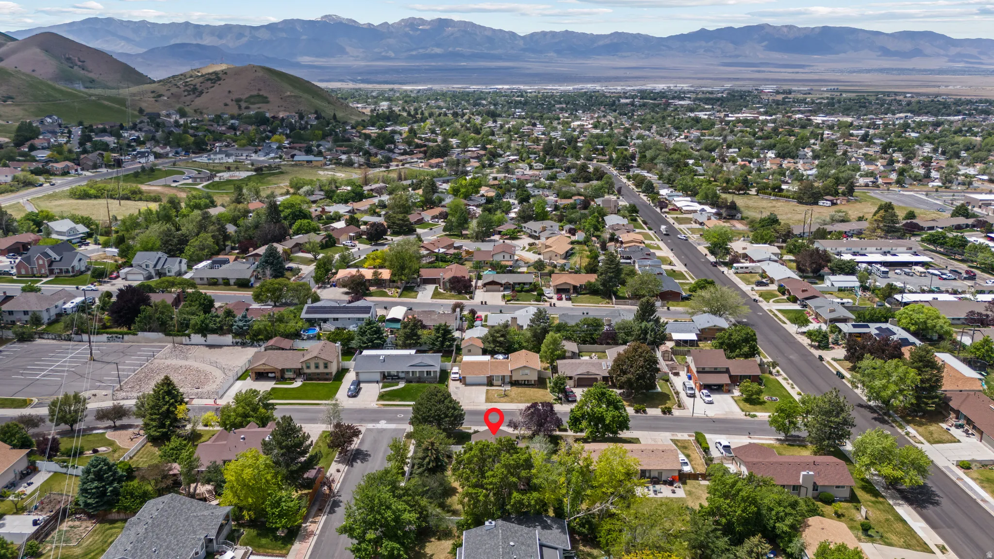 Aerial perspective showcasing a residential neighborhood with established trees and streetscapes