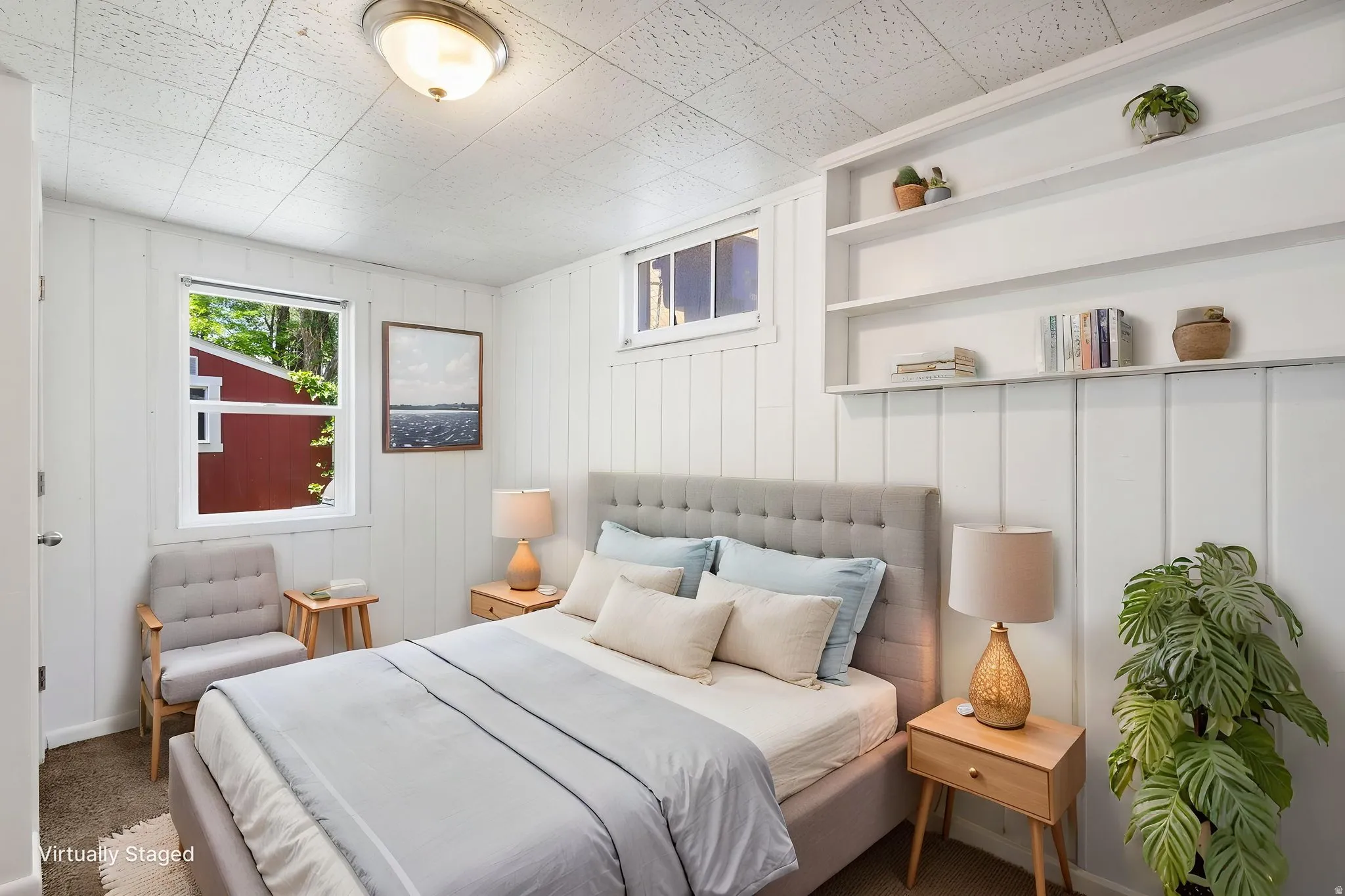 Room featuring white board and batten walls, a single window, and a smaller upper window, virtually staged