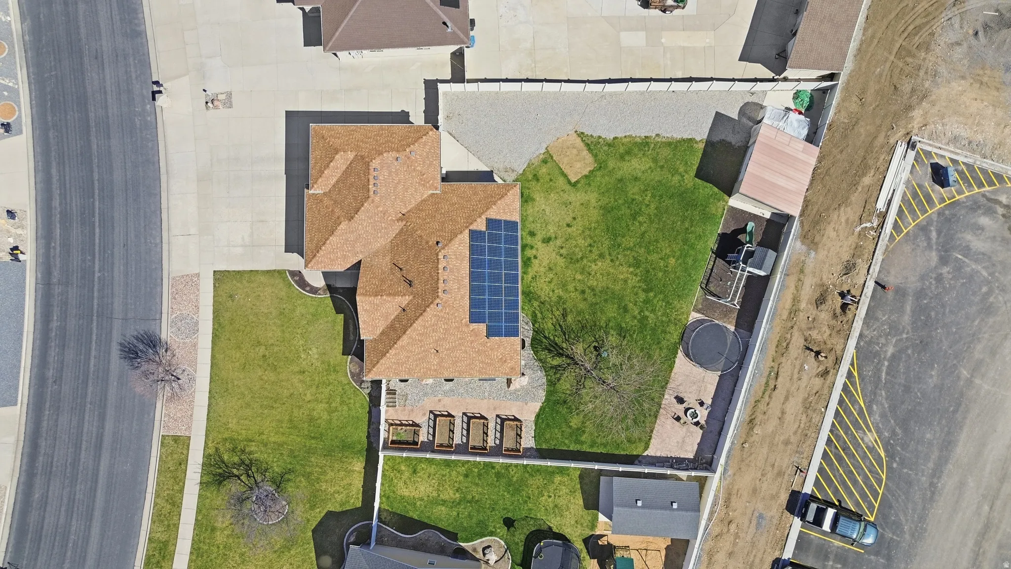 Brown shingle roof with solar panels
