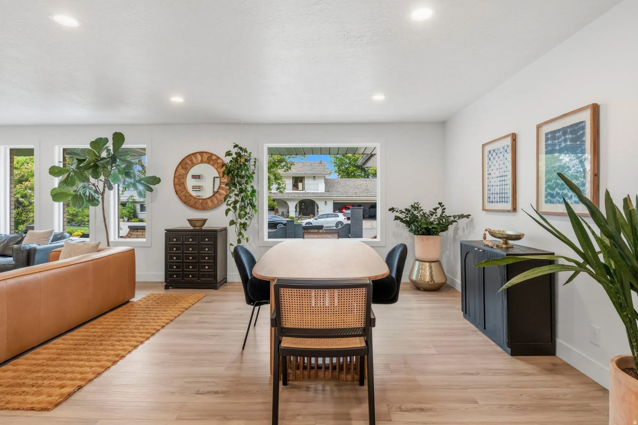 Open-concept living area featuring light wood-finish flooring throughout