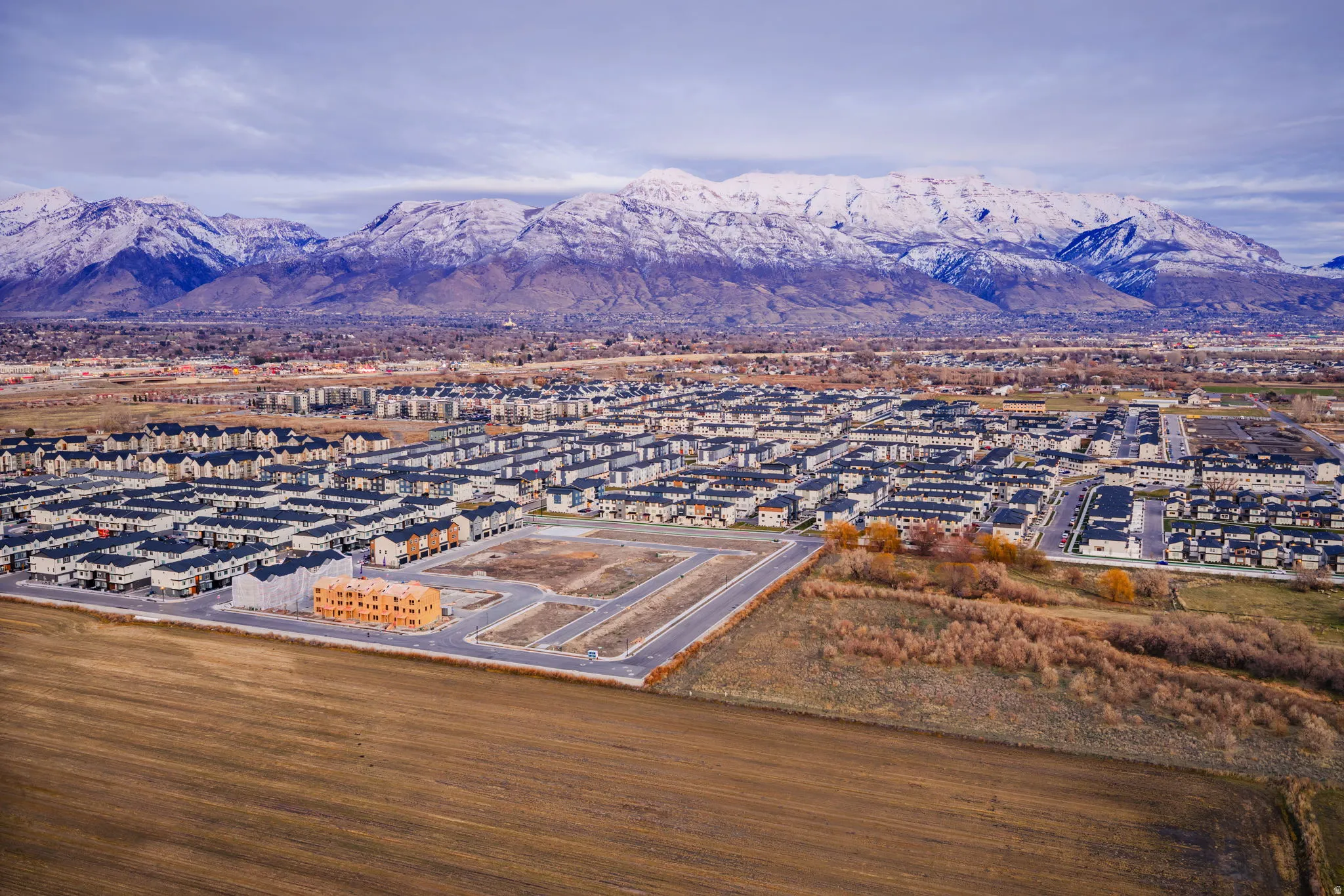 Expansive undeveloped land parcels with visible road infrastructure