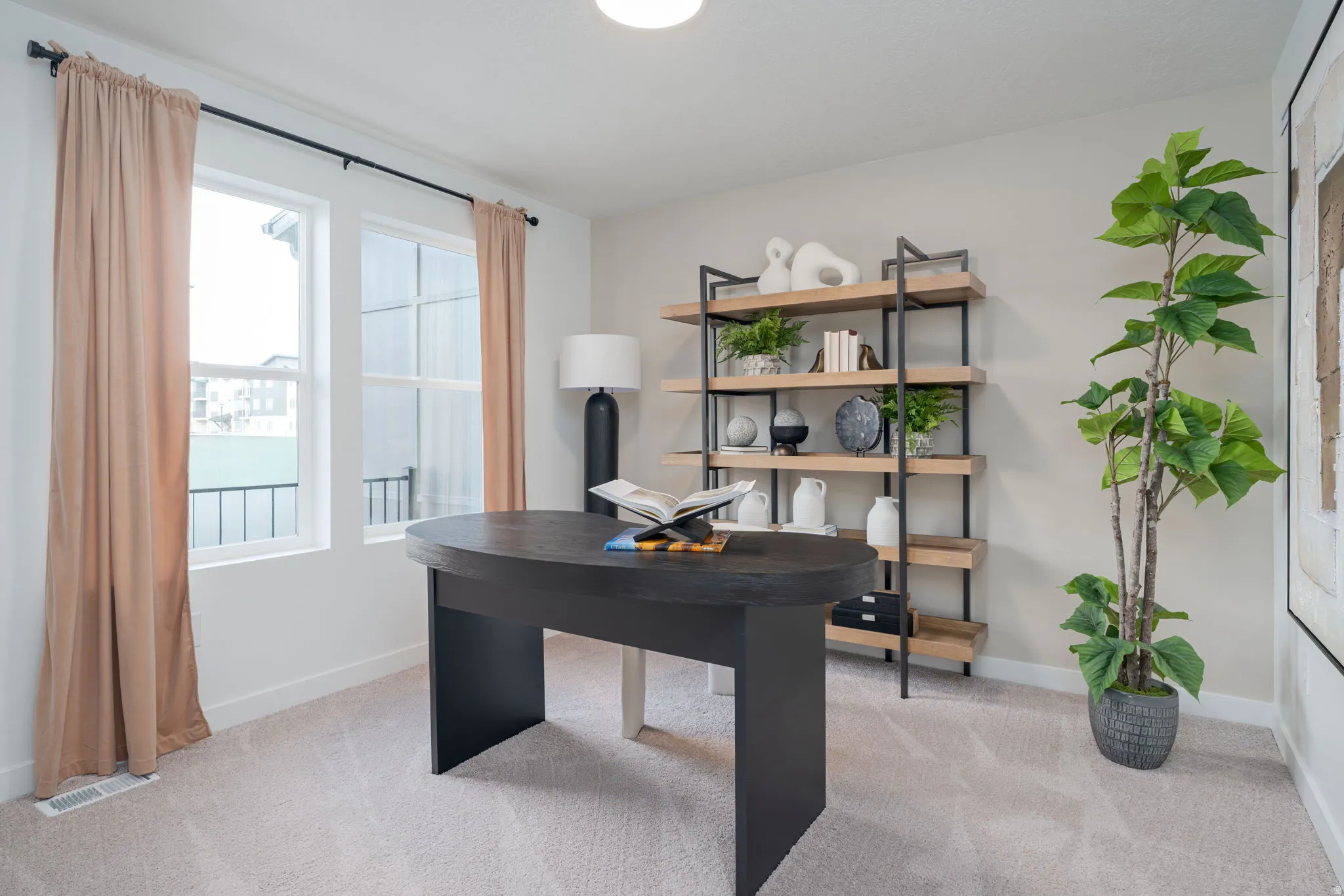 Room featuring light gray carpeting and neutral wall tones