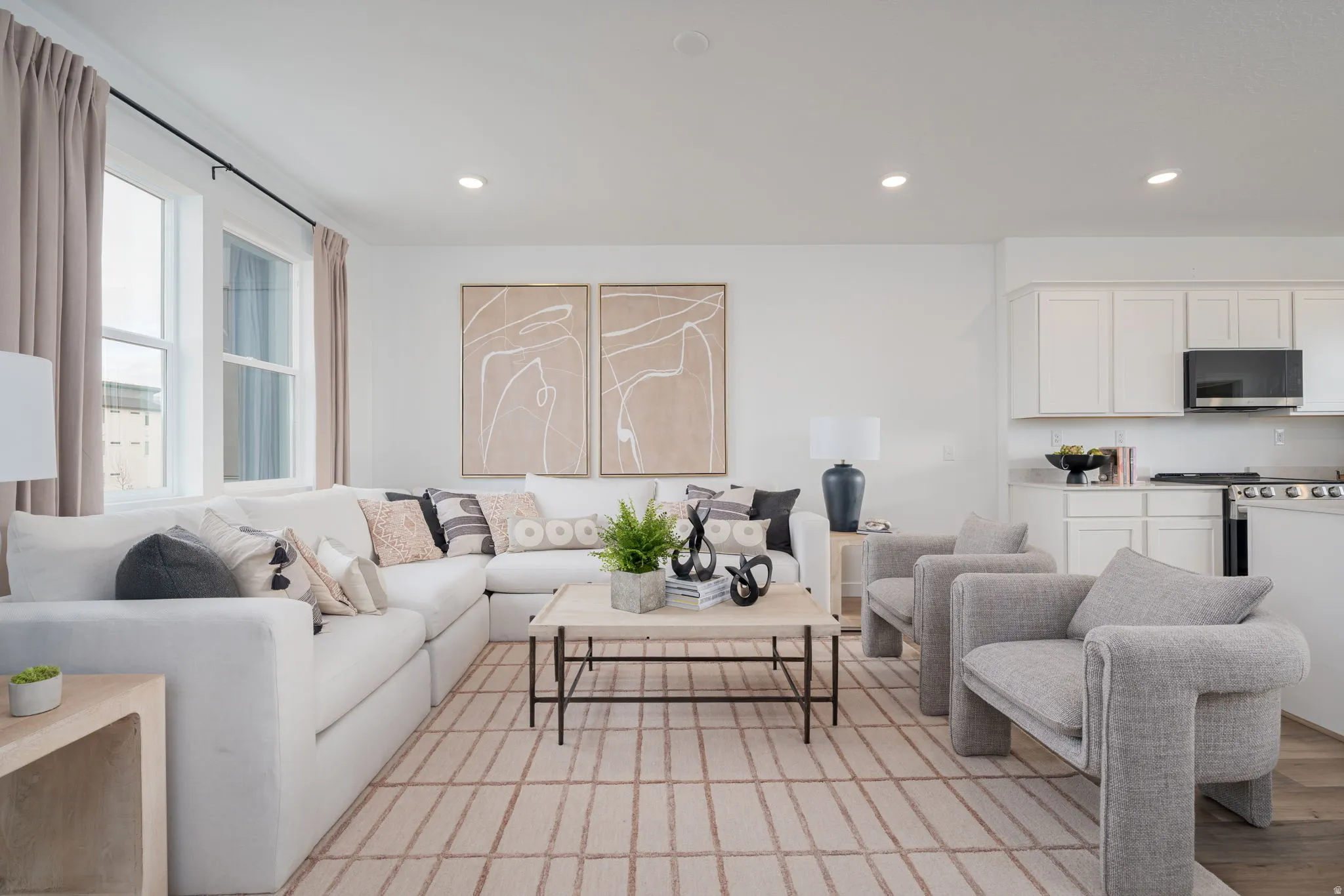 Open-concept living space featuring recessed lighting, multi-pane windows, and wood-finish flooring