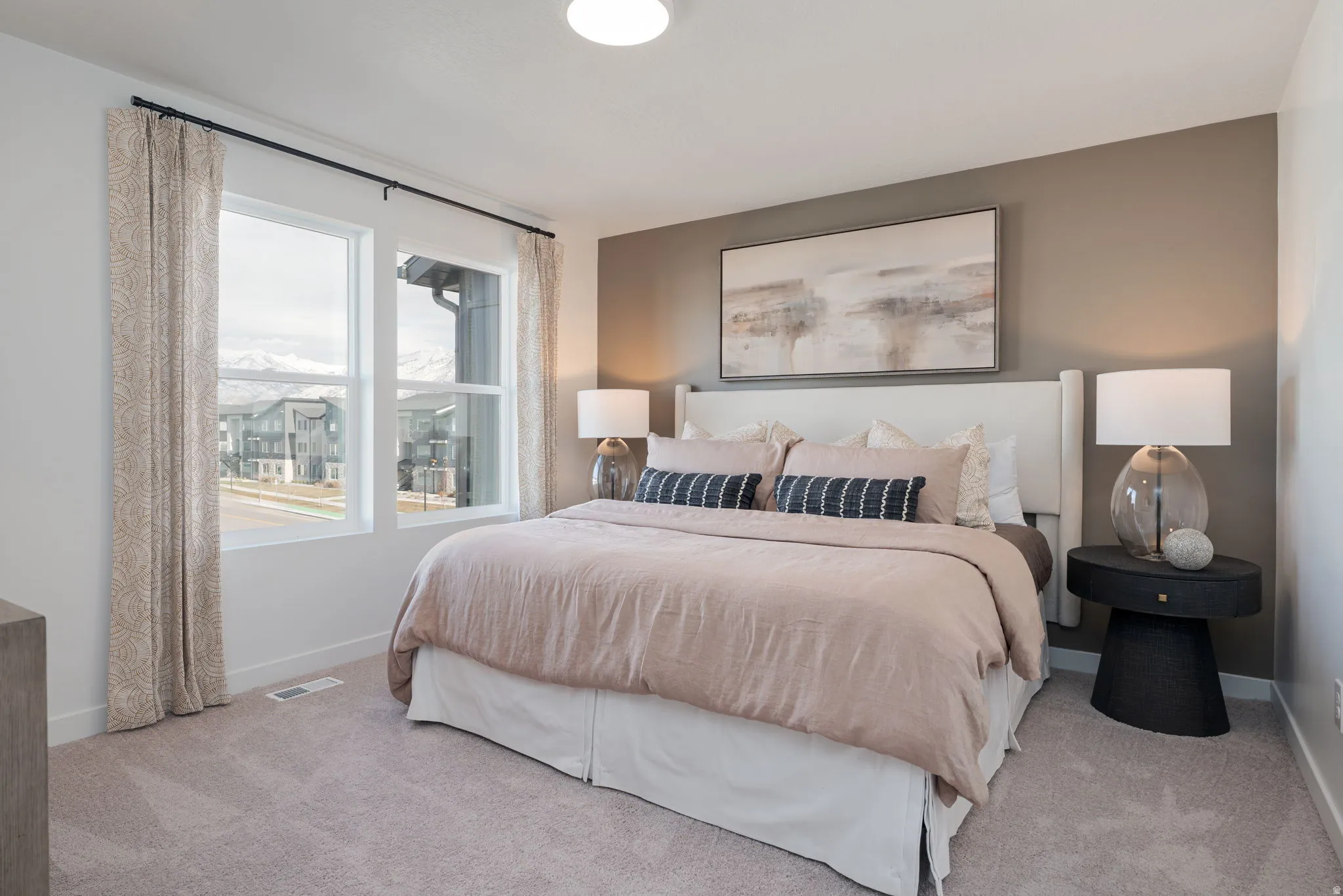 Plush carpet flooring complements a neutral wall palette