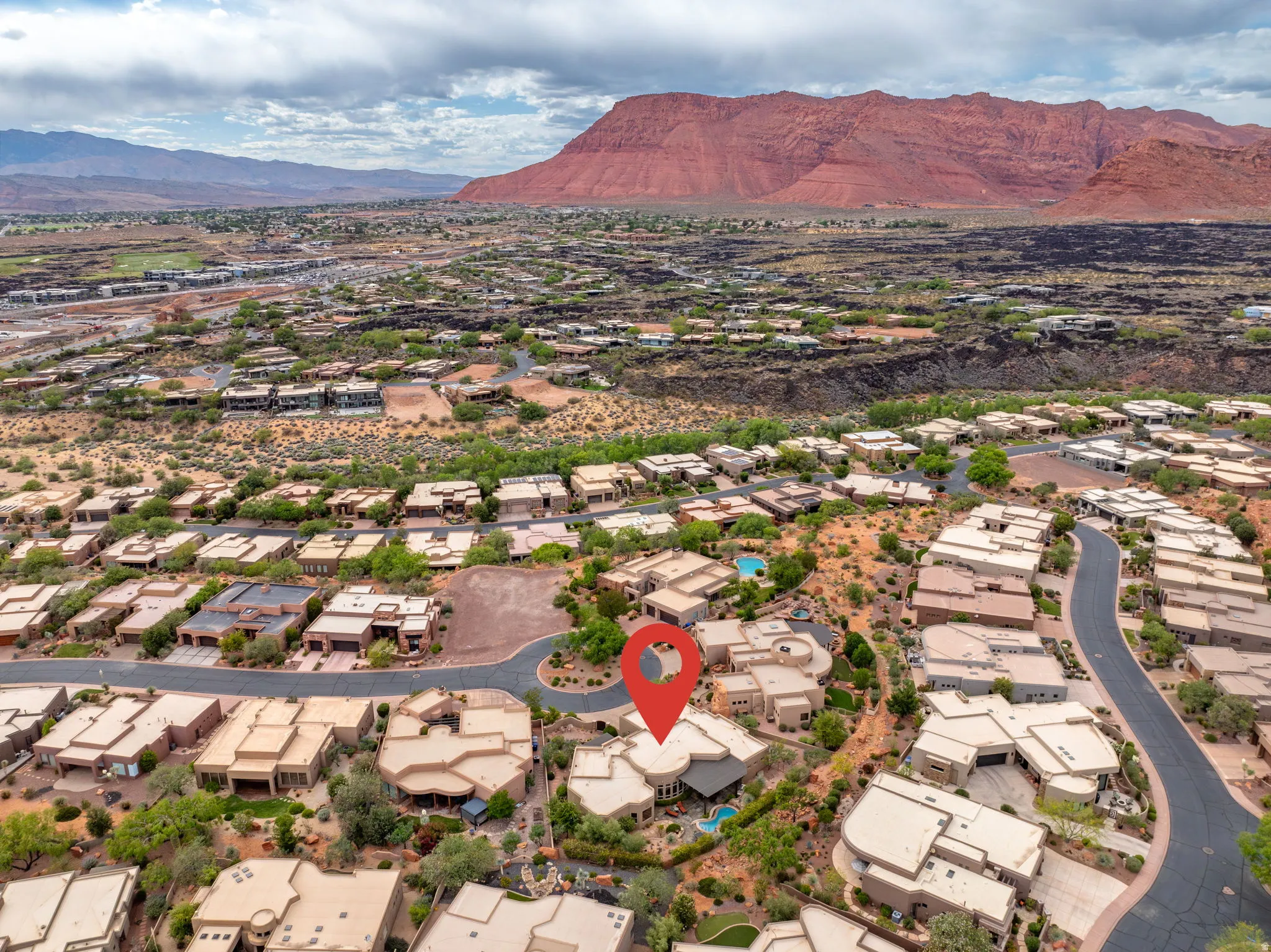 Aerial perspective showcasing a residential community within a desert landscape