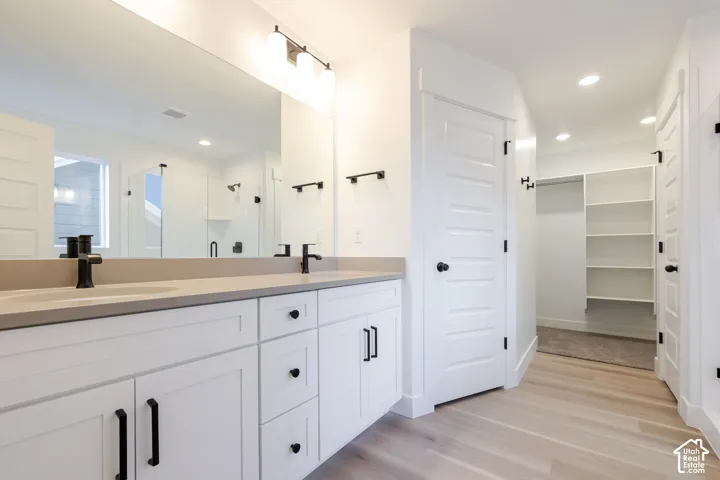 Dual vanity with matte black fixtures and light-toned countertop