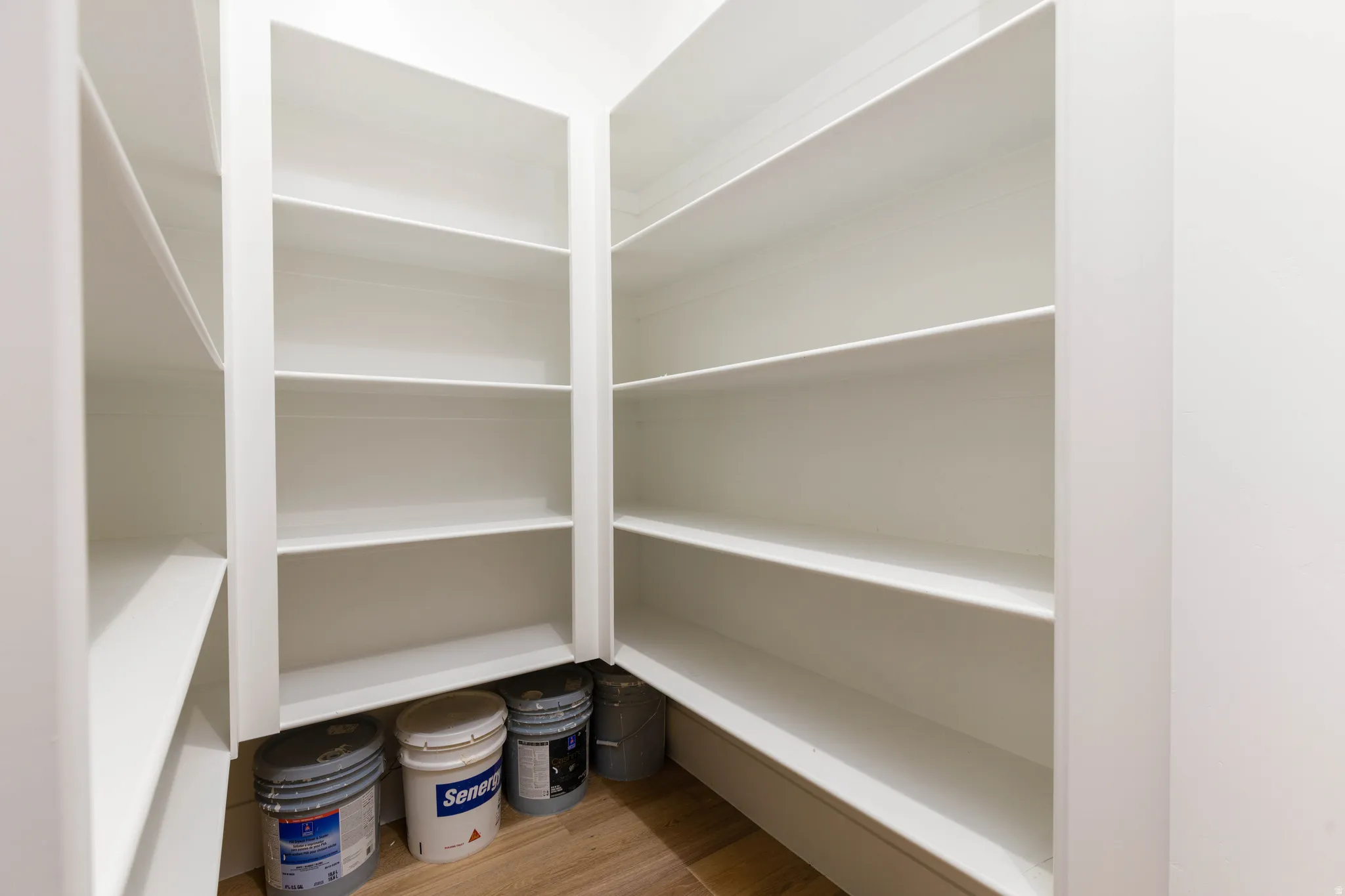 Built-in shelving system with white finishes
