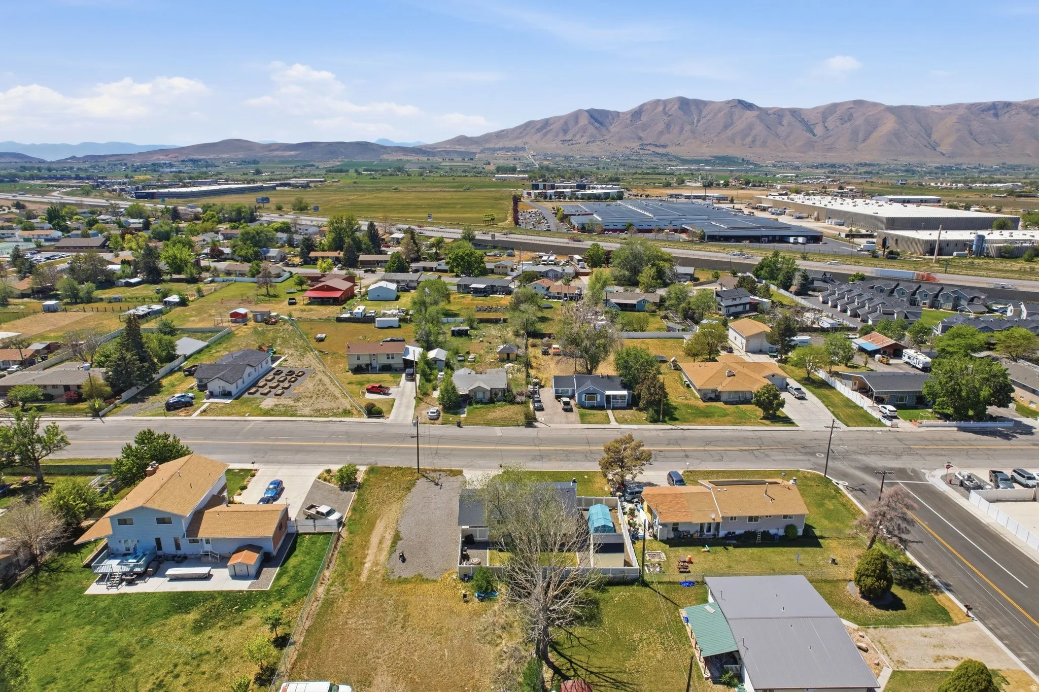Aerial perspective showcasing a residential area with varied home styles and mature trees