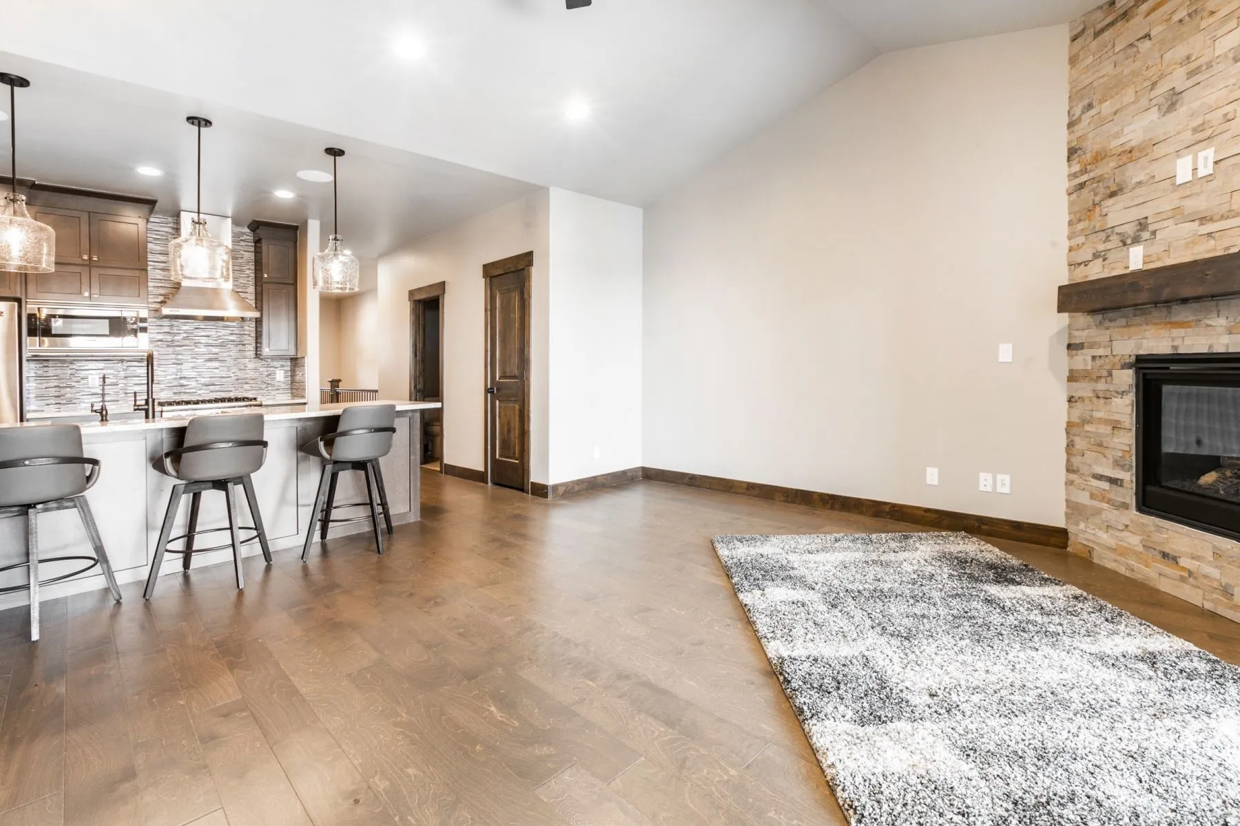 Open-concept living space featuring wood-finish flooring