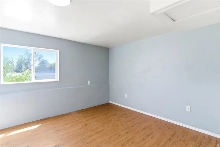 Light blue painted walls with white trim and wood-finish flooring