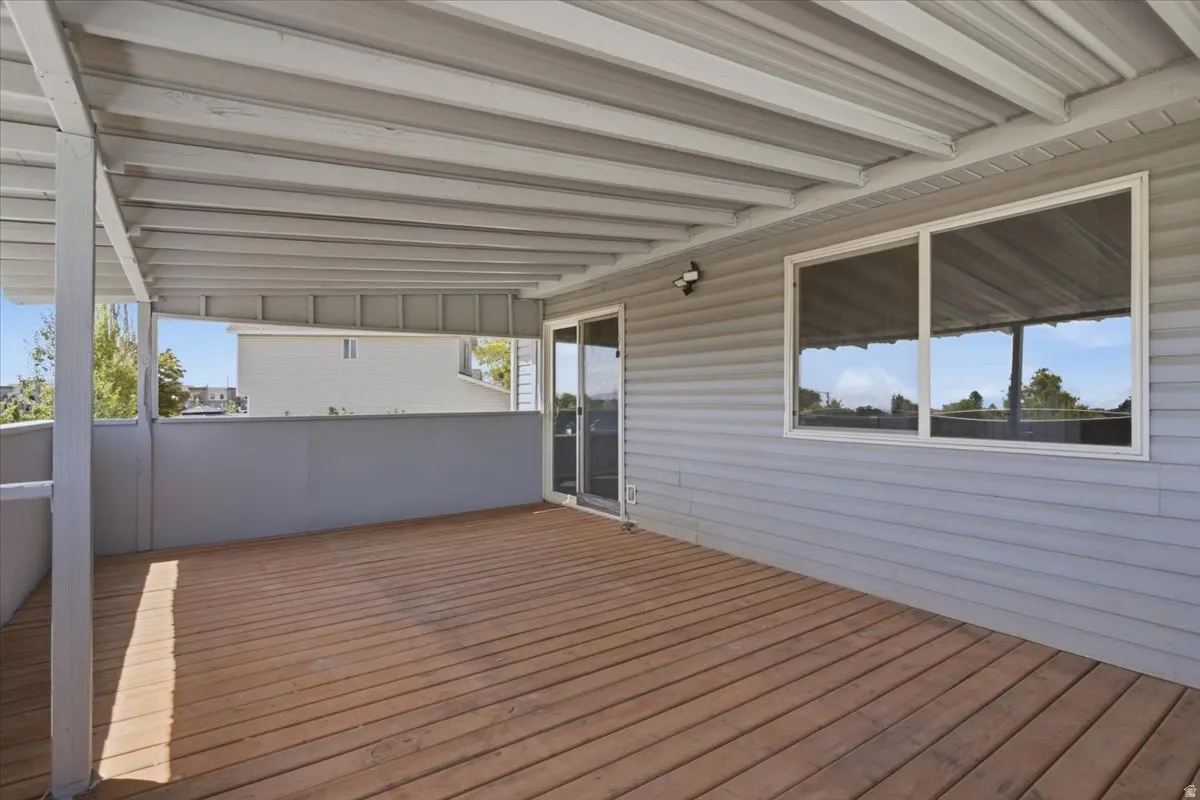 Expansive covered deck with wood-finish flooring