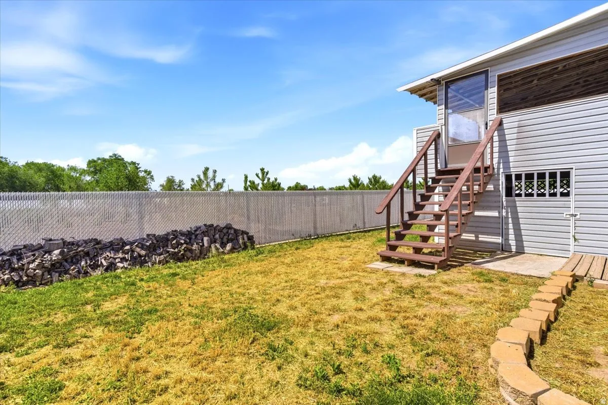 Exterior featuring horizontal siding and a full-light storm door