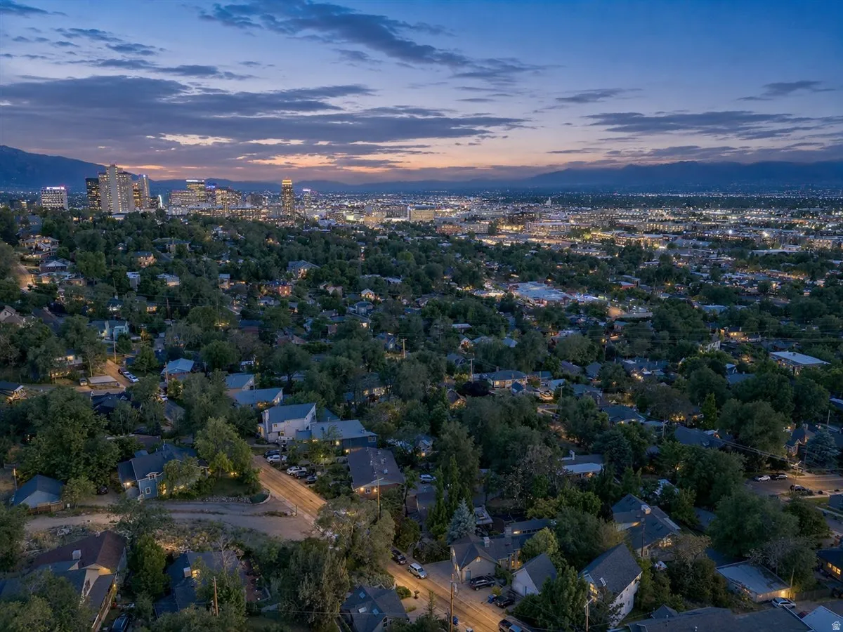 Expansive residential area featuring numerous single-family homes nestled among mature trees