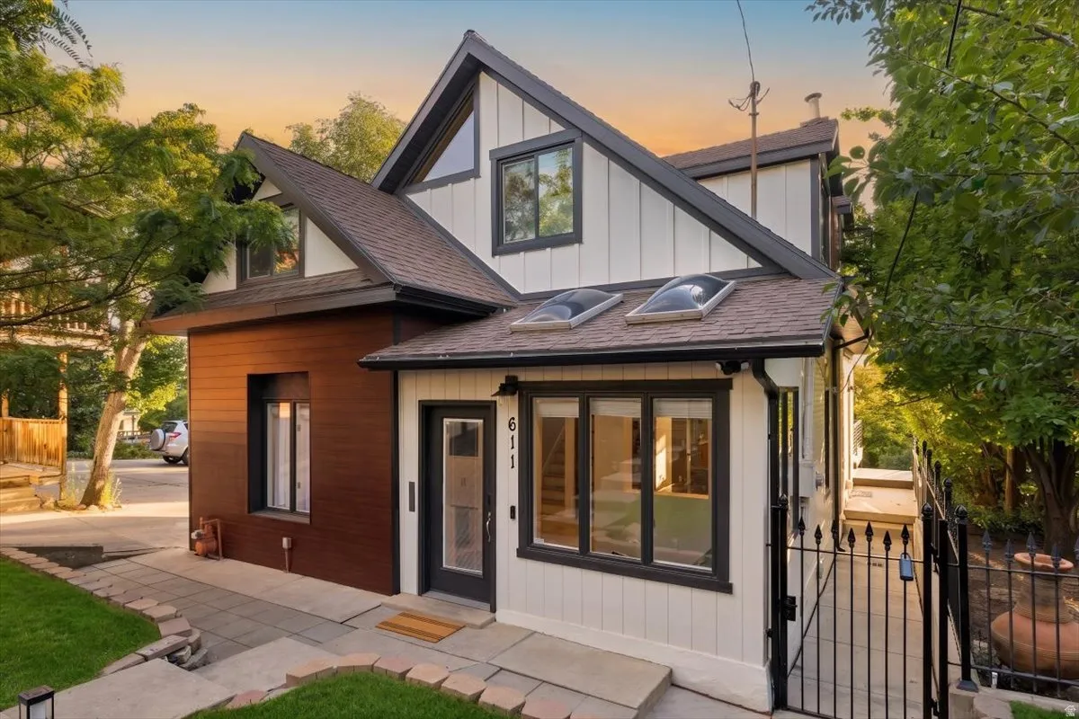 Crafted exterior with multi-toned siding, featuring board and batten accents