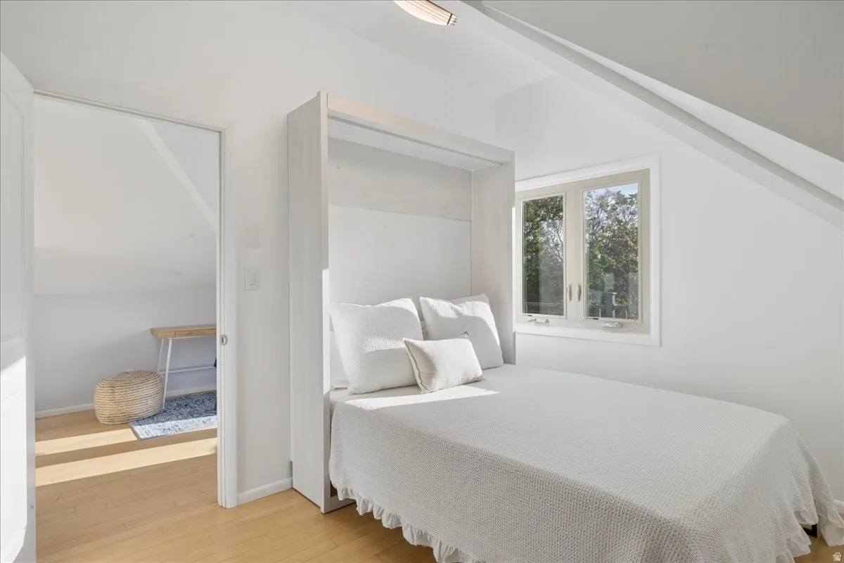 Integrated wall bed system with white cabinetry