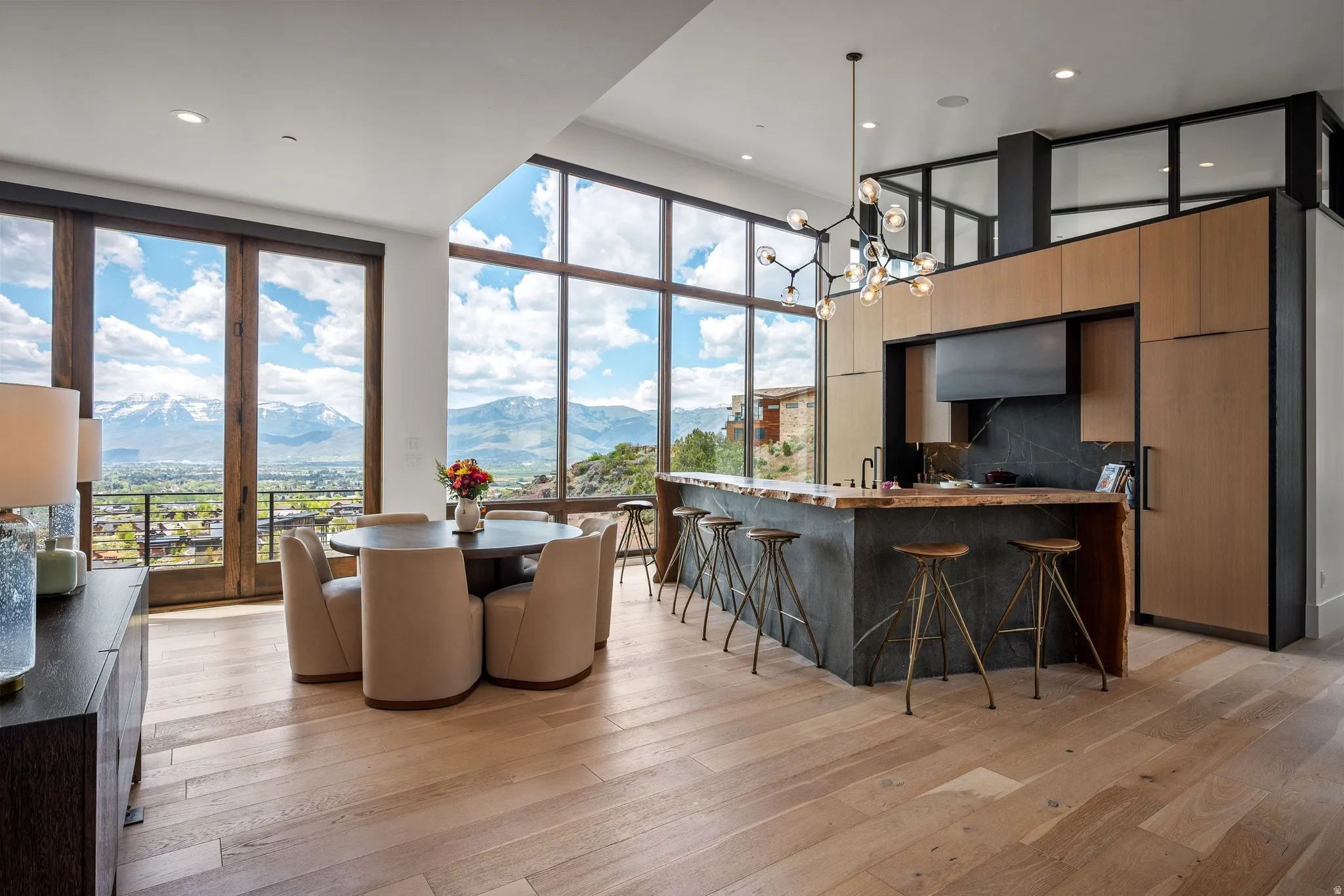 Expansive window wall with mountain scenery
