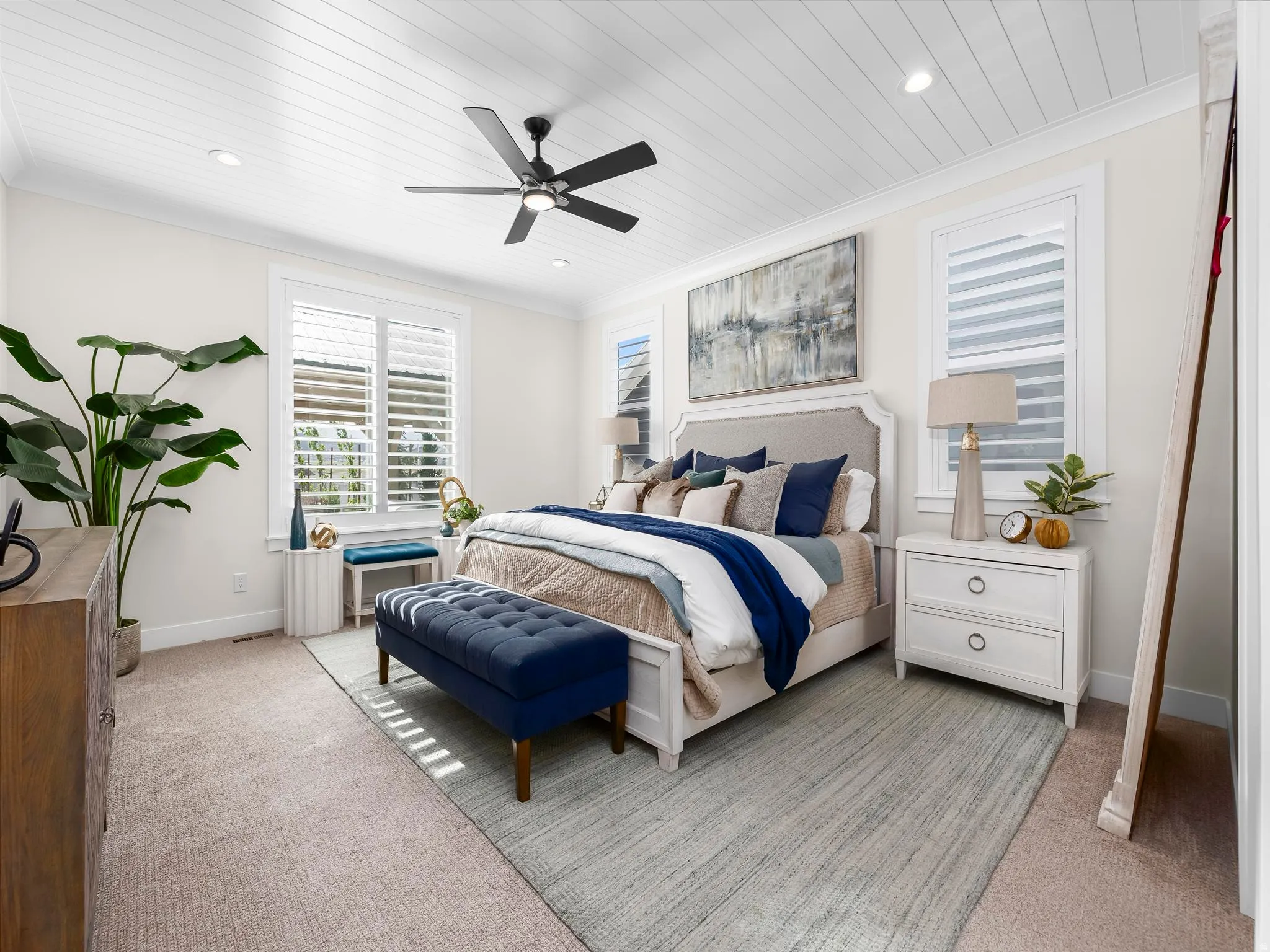 Carpeted interior room featuring a shiplap ceiling with recessed lighting and a black ceiling fan