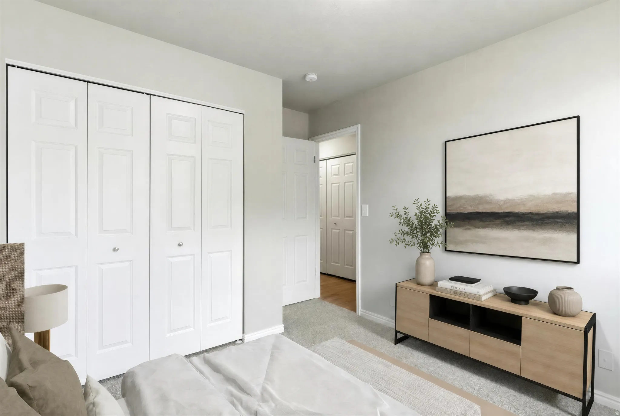 Two bi-fold closet doors with panel detailing