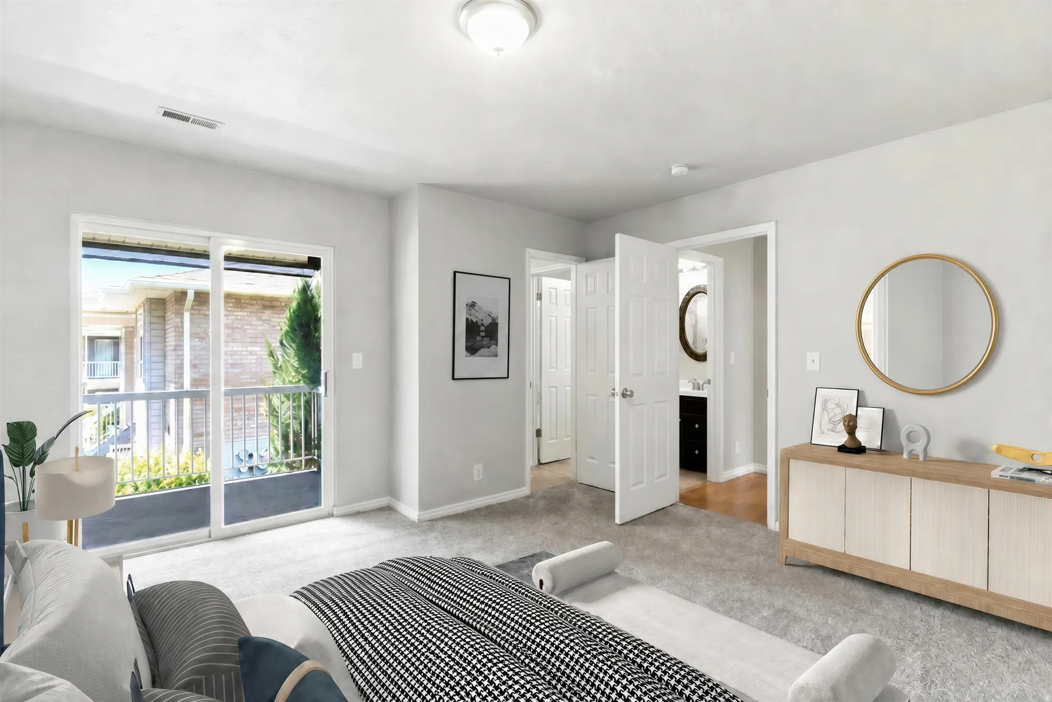 Bedroom featuring a sliding glass door leading to a balcony, light gray wall paint, and gray carpet flooring