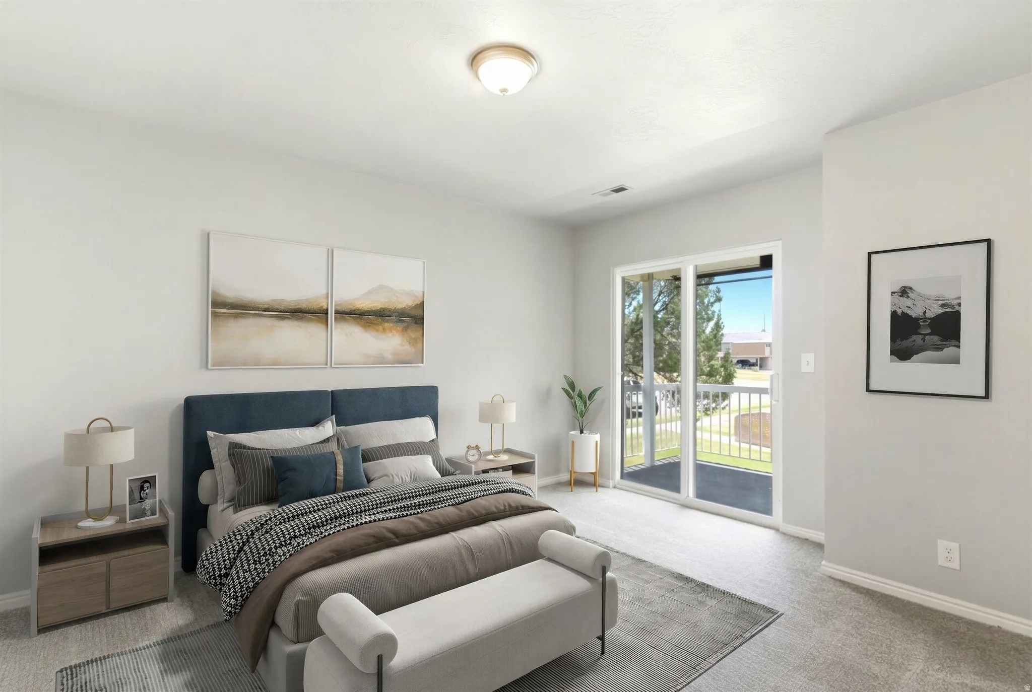Neutral-toned bedroom featuring wall-to-wall carpeting and a ceiling-mounted light fixture