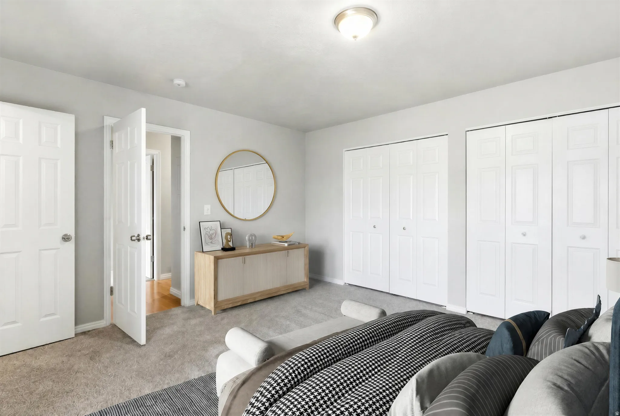 Interior room featuring carpet flooring and light gray walls