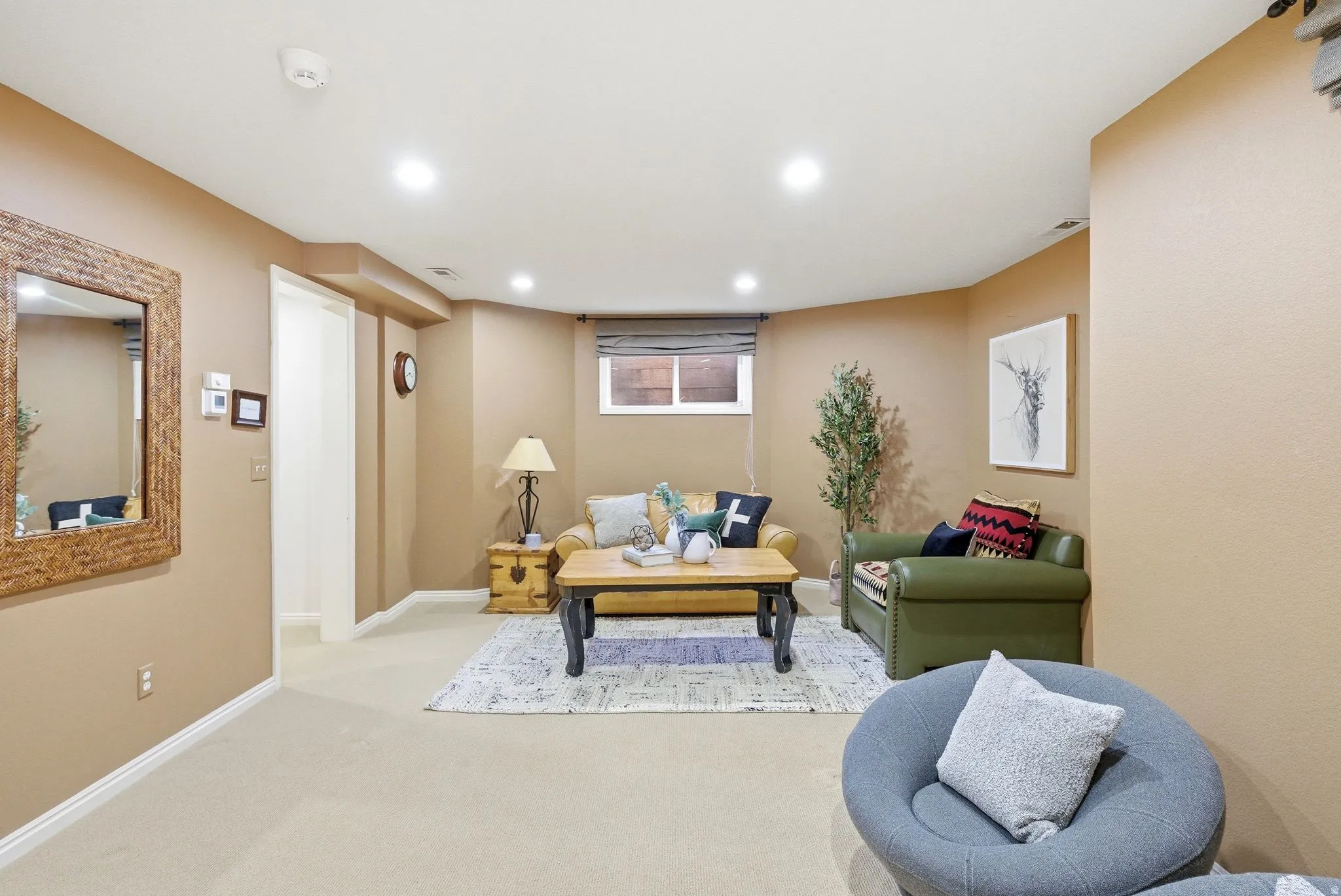 Recreational room featuring recessed lighting, a window with blinds, and neutral wall tones