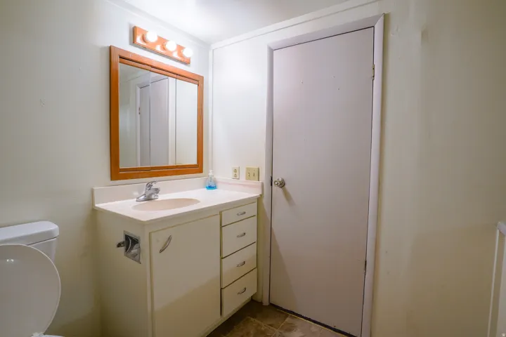 Vanity with an integrated sink and laminate countertop