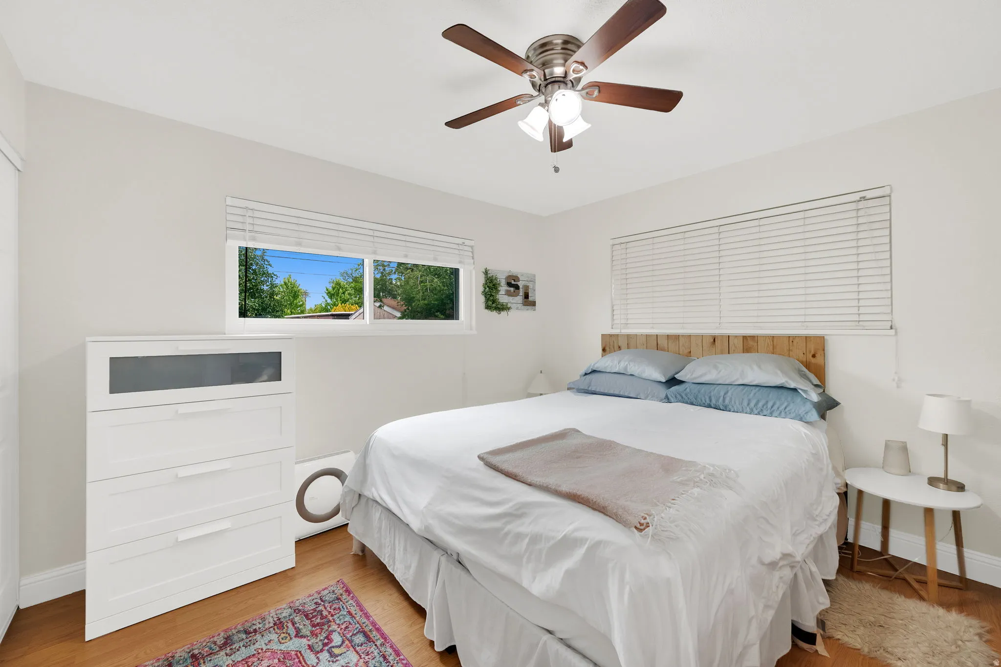 Wood-finish flooring complements light-toned walls