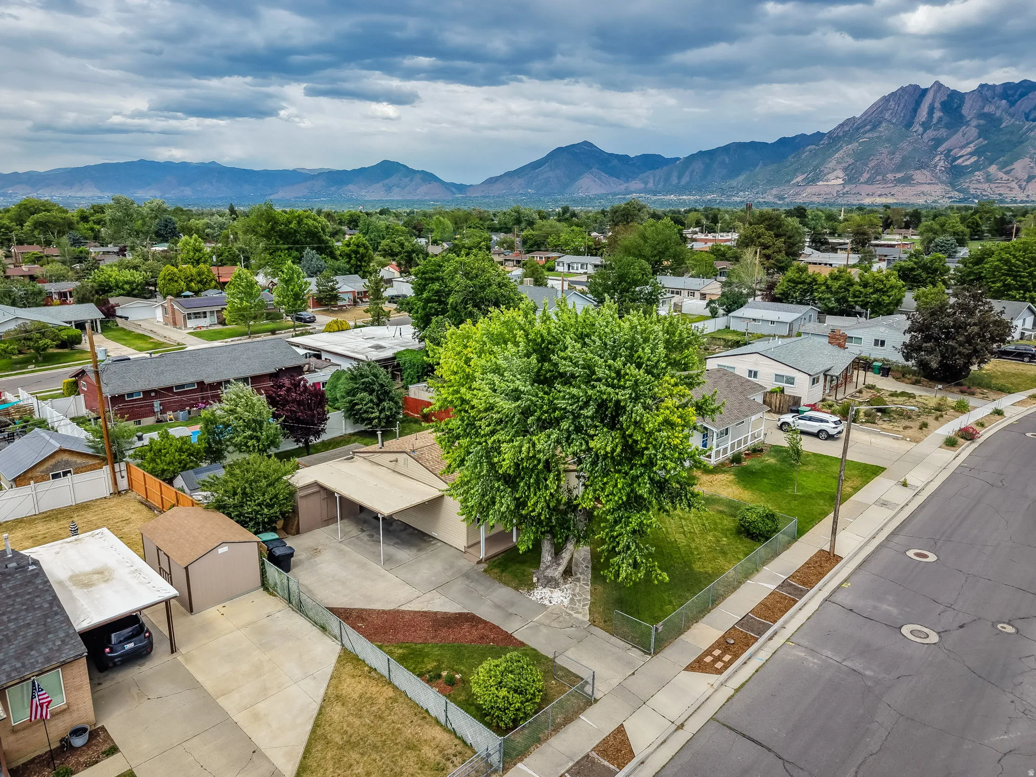 Expansive mountain range backdrop framing a residential neighborhood