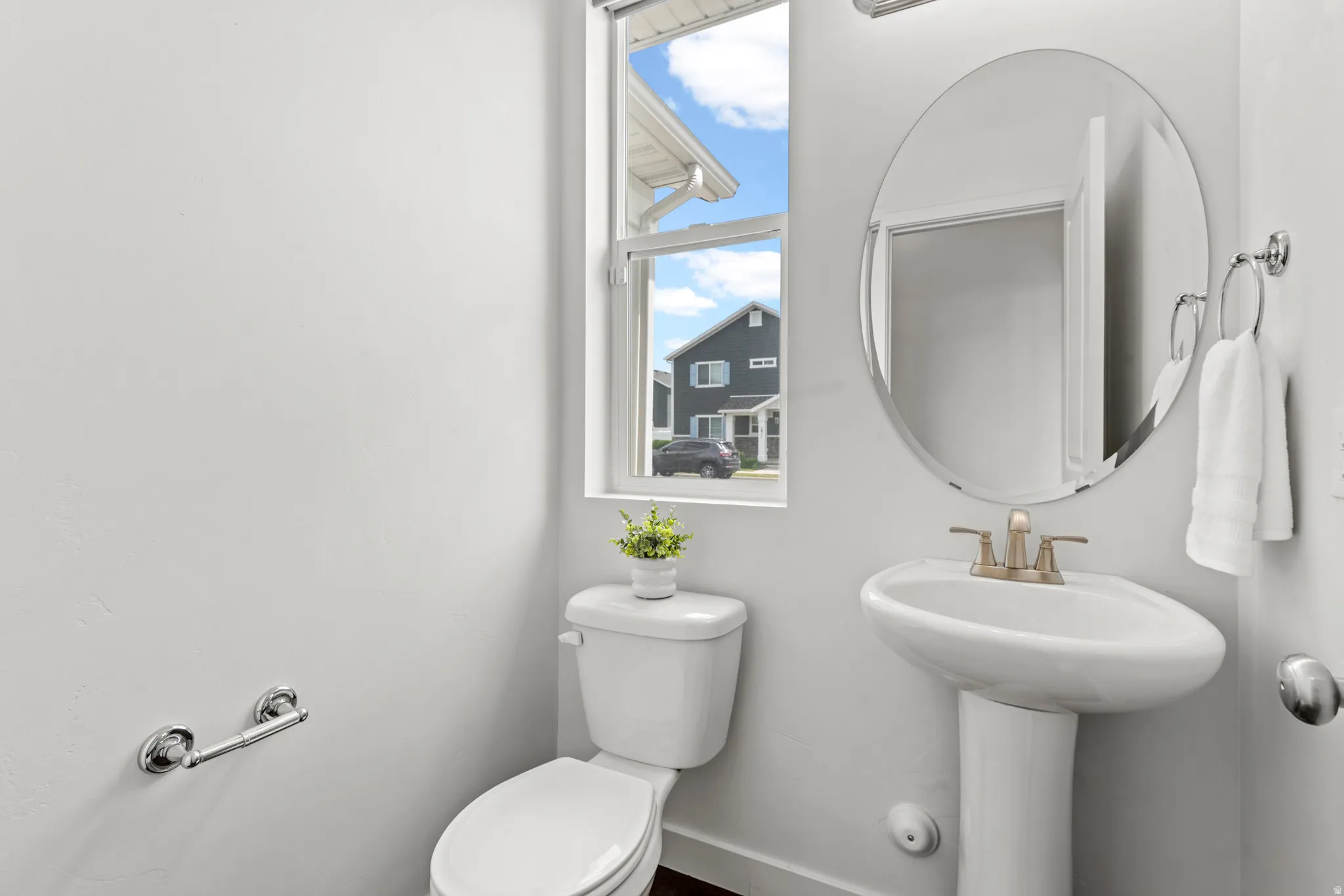 Pedestal sink with brass-finish faucet