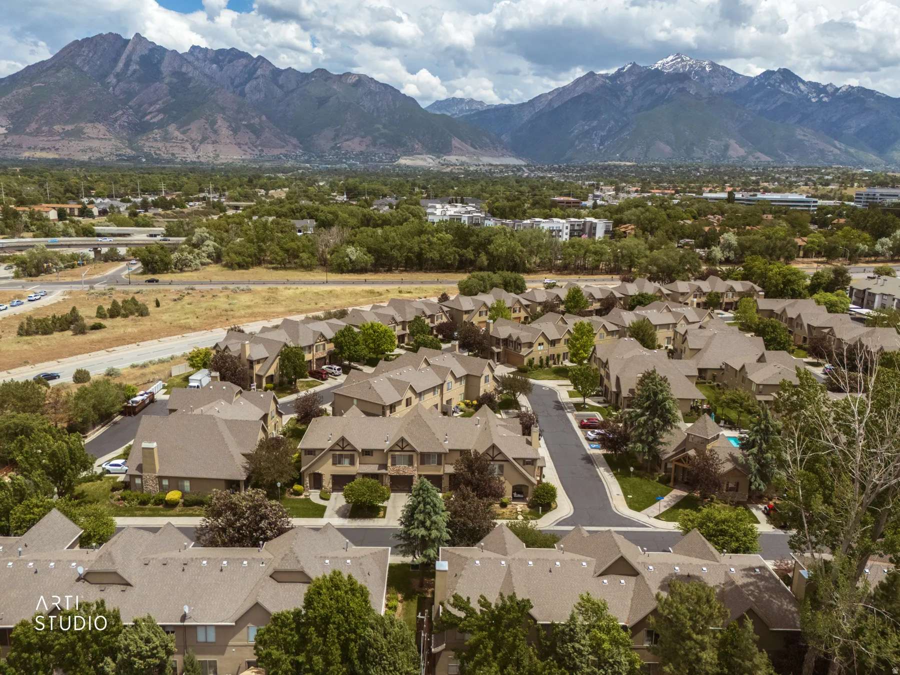 Extensive residential development nestled against a prominent mountain range