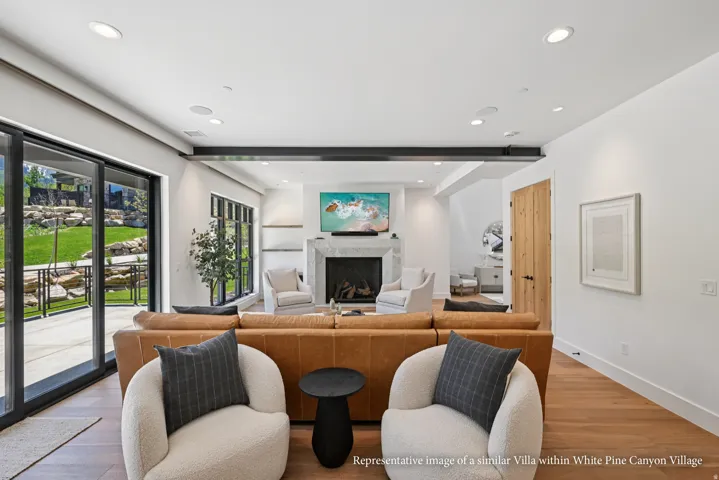 Hardwood flooring, recessed lighting, and sliding glass doors with direct patio access