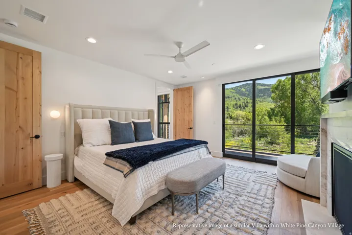 Floor-to-ceiling windows, wood-finish flooring, recessed lighting, ceiling fan, and solid wood doors