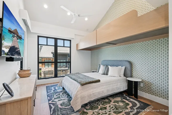 Vaulted ceiling with recessed lighting and ceiling fan, large black-framed window, built-in elevated bunk, and wood-finish flooring